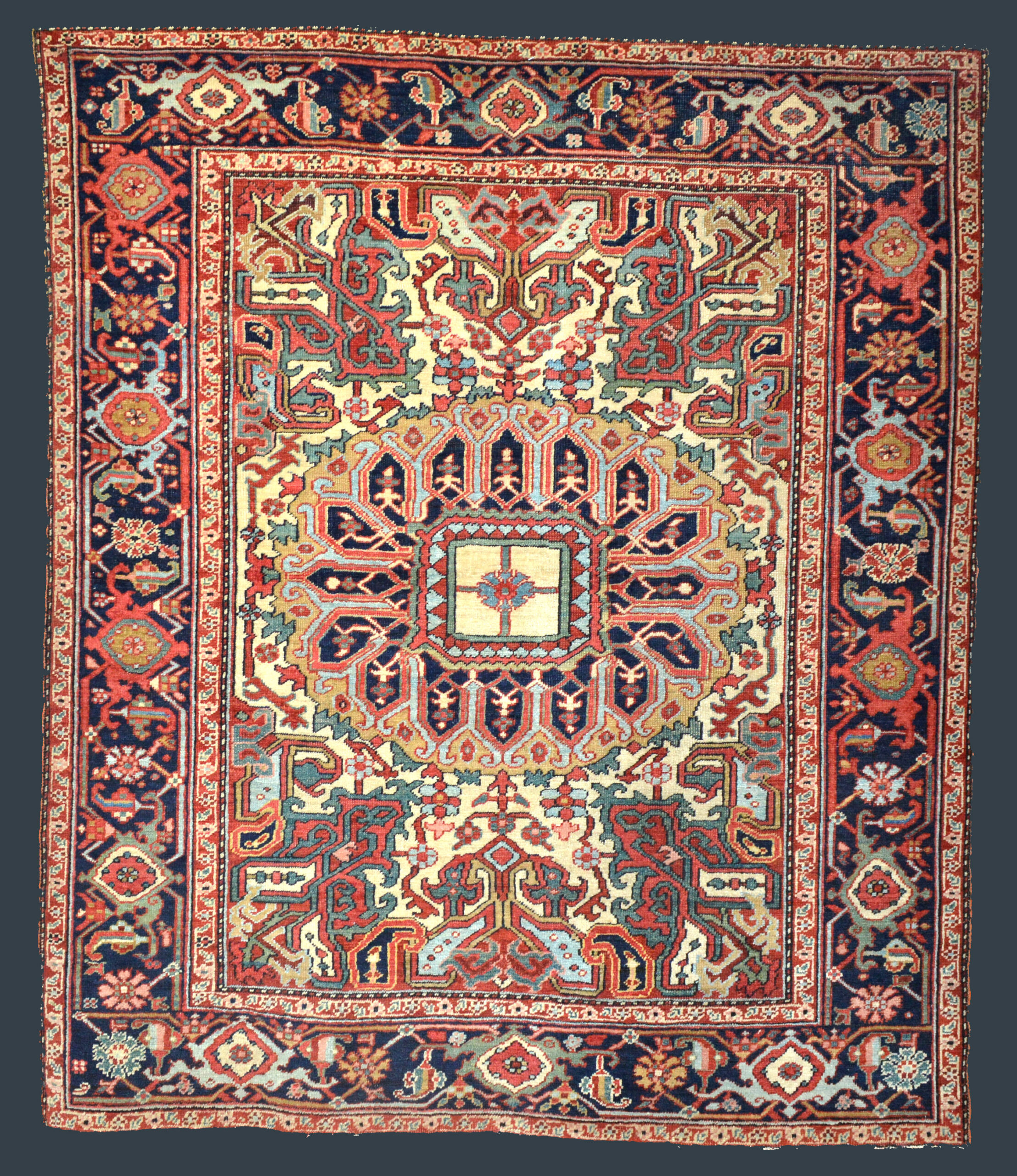 Antique Heriz Serapi rug with ivory field and a complex central medallion