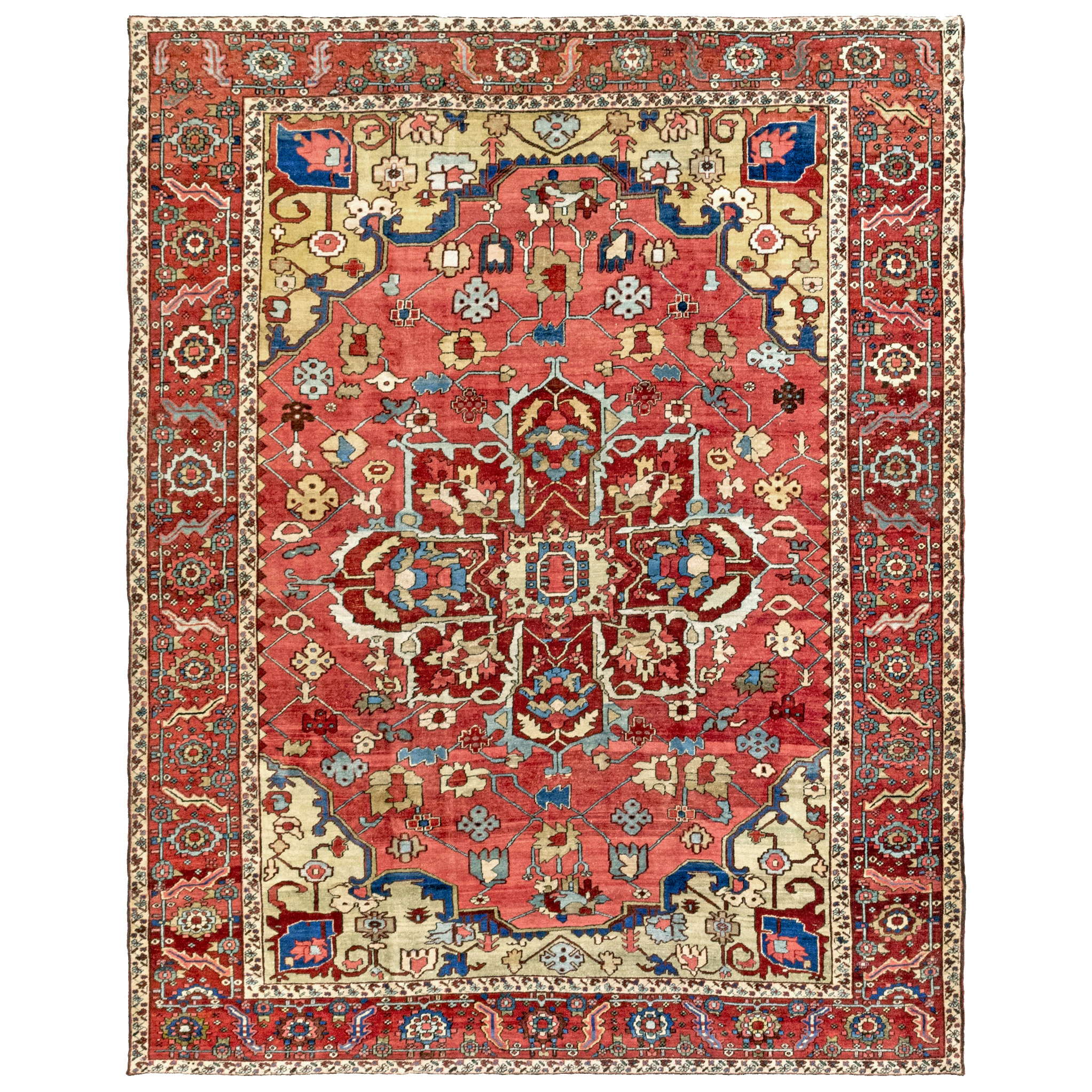 Room size antique Persian Heri "Serapi" carpet with a brick red medallion on a coral color field that is decorated with stylized flowers. Variegated yellow-green and Celadon green corner spandrels and a brick red border frame the field. Northwest Persia, circa 1900. Douglas Stock Gallery is a Boston,MA area dealer specializing in highly select antique Oriental rugs and room size carpets, including antique Heriz, "Serapi", Karaja and Bakshaish carpets from the Heriz district. Antique Heriz carpets New York by appointment.