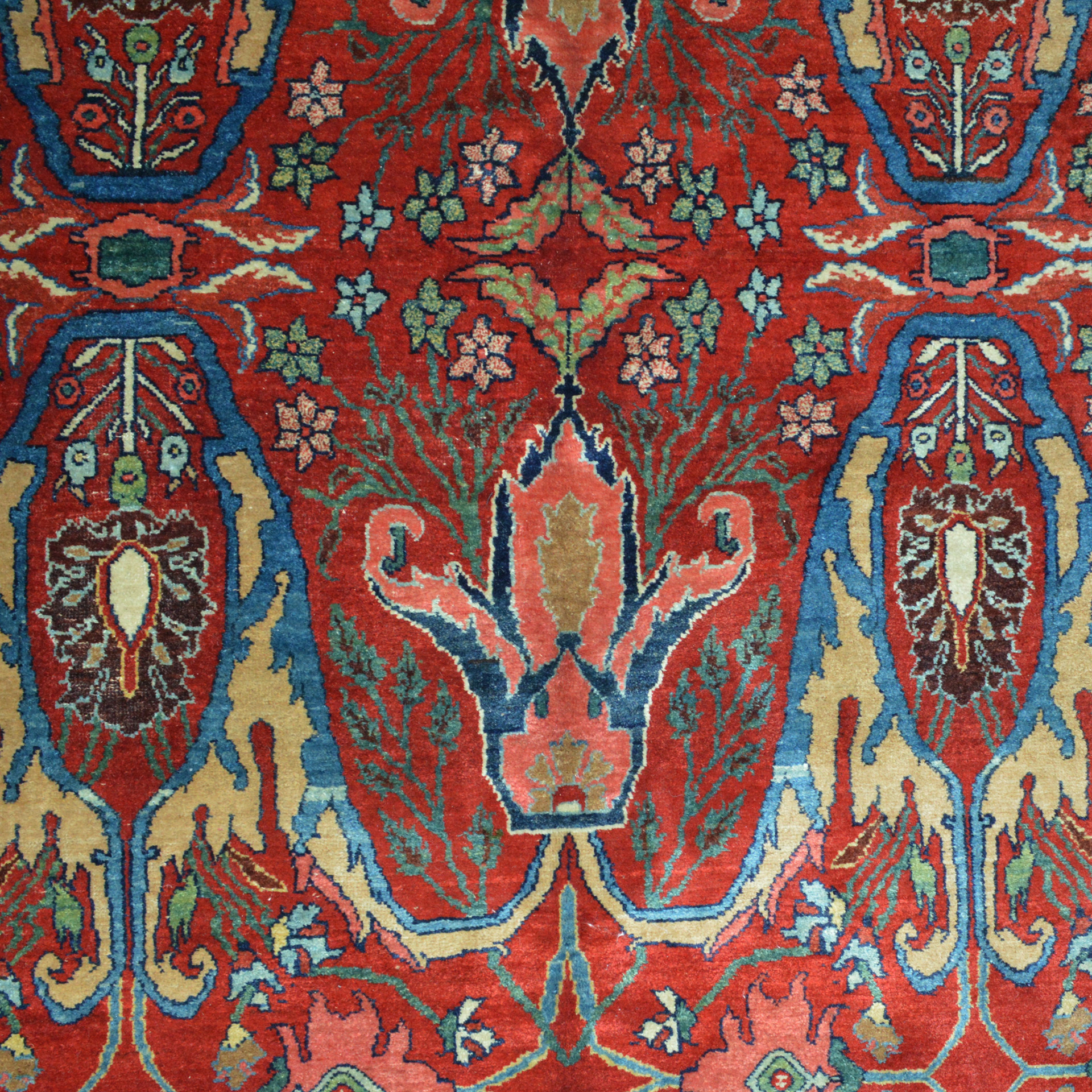 Calyx design field detail in an antique Persian Bidjar carpet