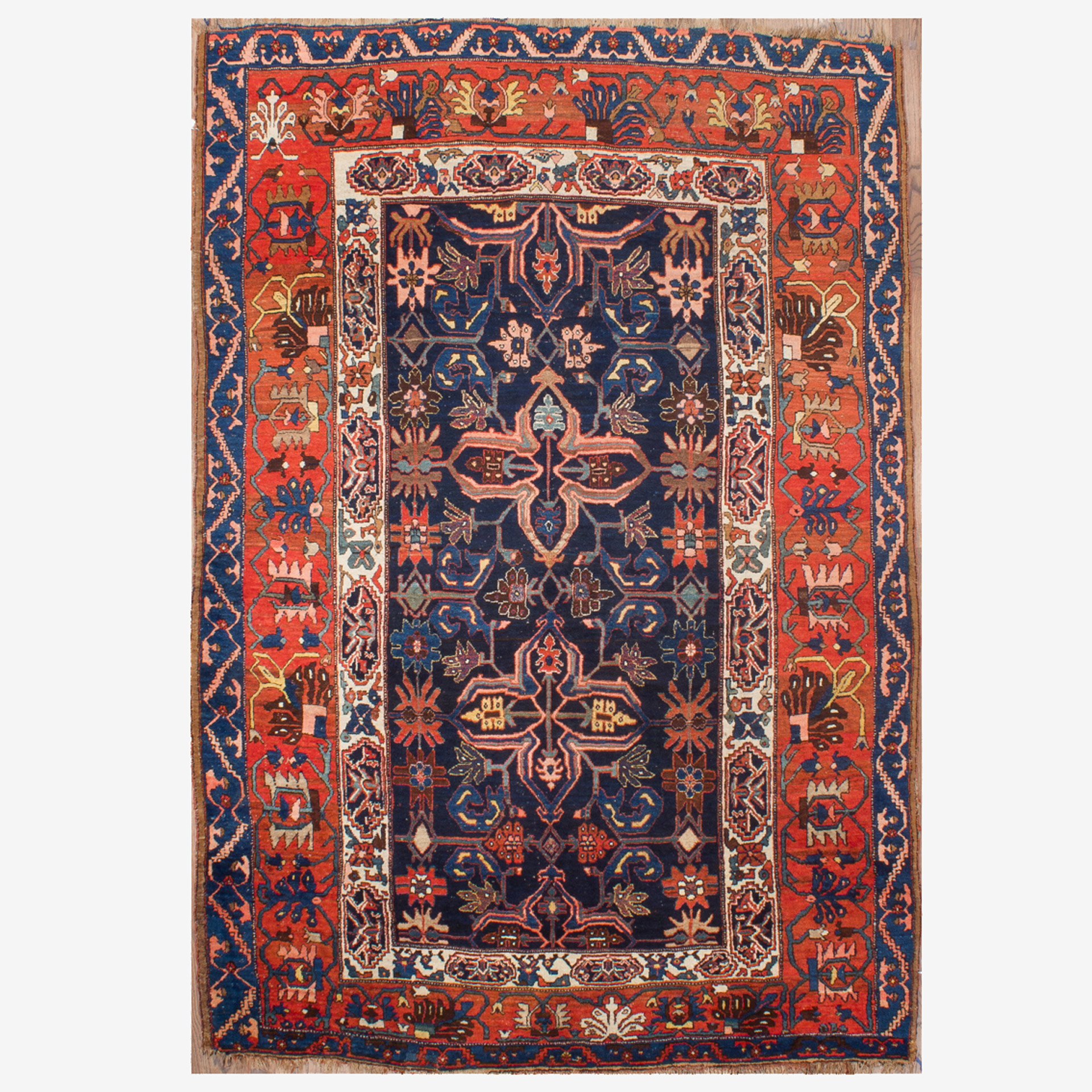 An antique Kurdish carpet from Bidjar in northwest Persia, featuring the Quatrefoil design on a navy field
