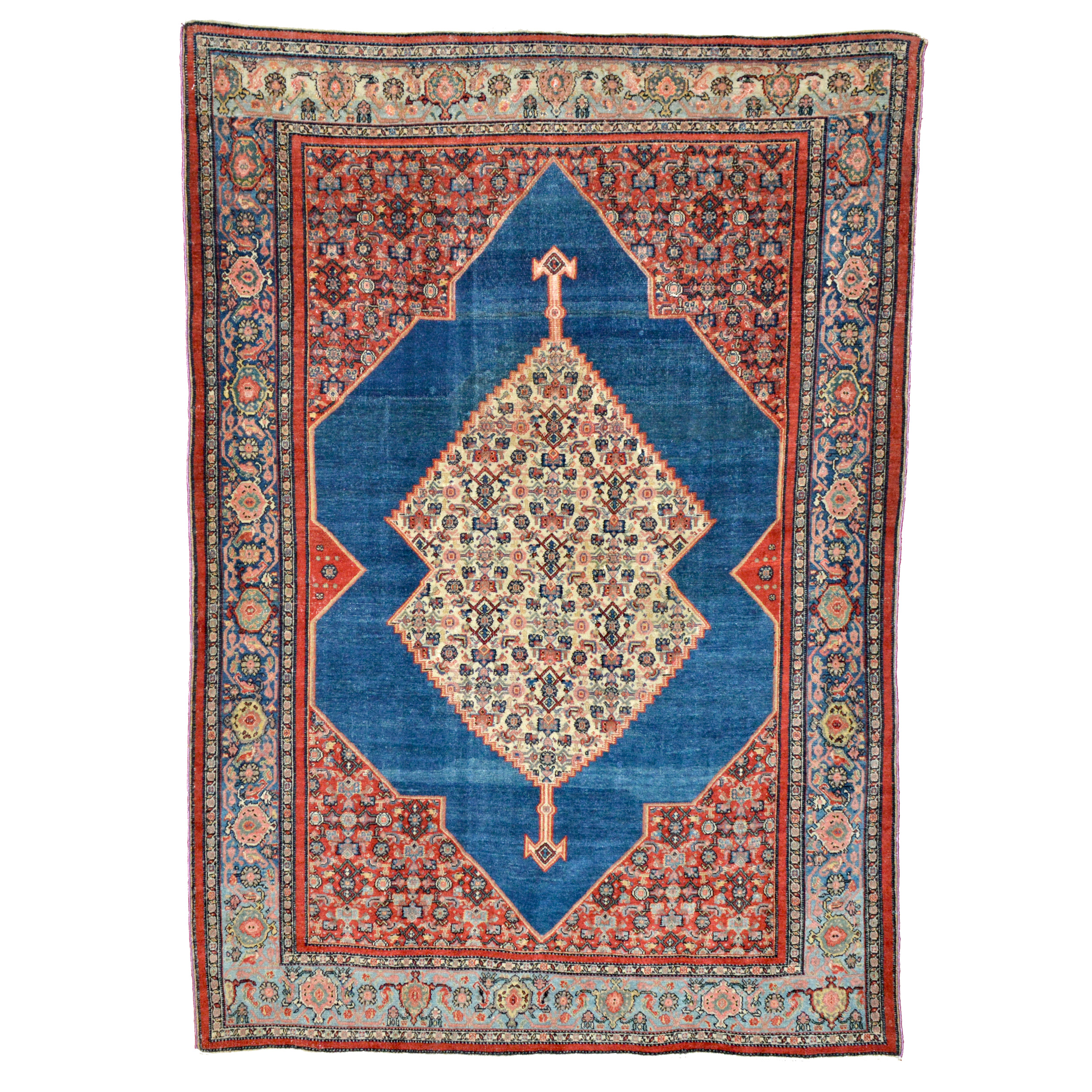 Antique northwest Persian Senneh rug with an abrashed denim blue open field and ivory medallion. Provenance: Boston area private collection, Amherst College (still retains label) - Douglas Stock Gallery, antique Oriental rugs Boston,MA area, New England