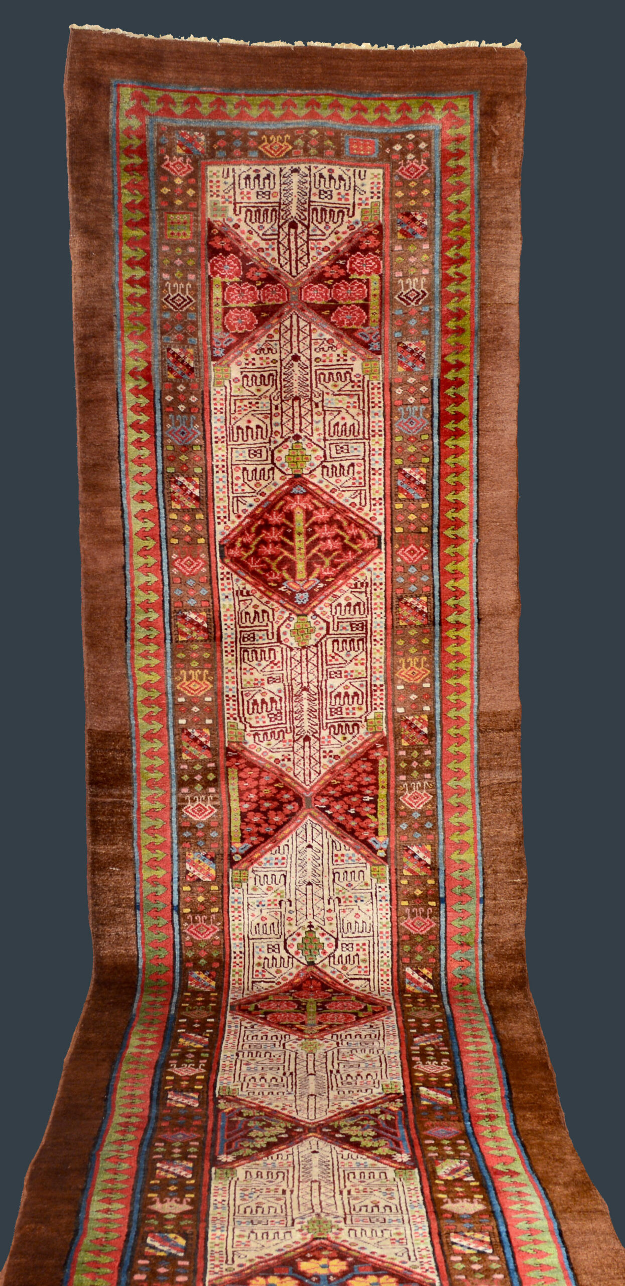 Antique Serab runner with aubergine color medallions on an ivory field