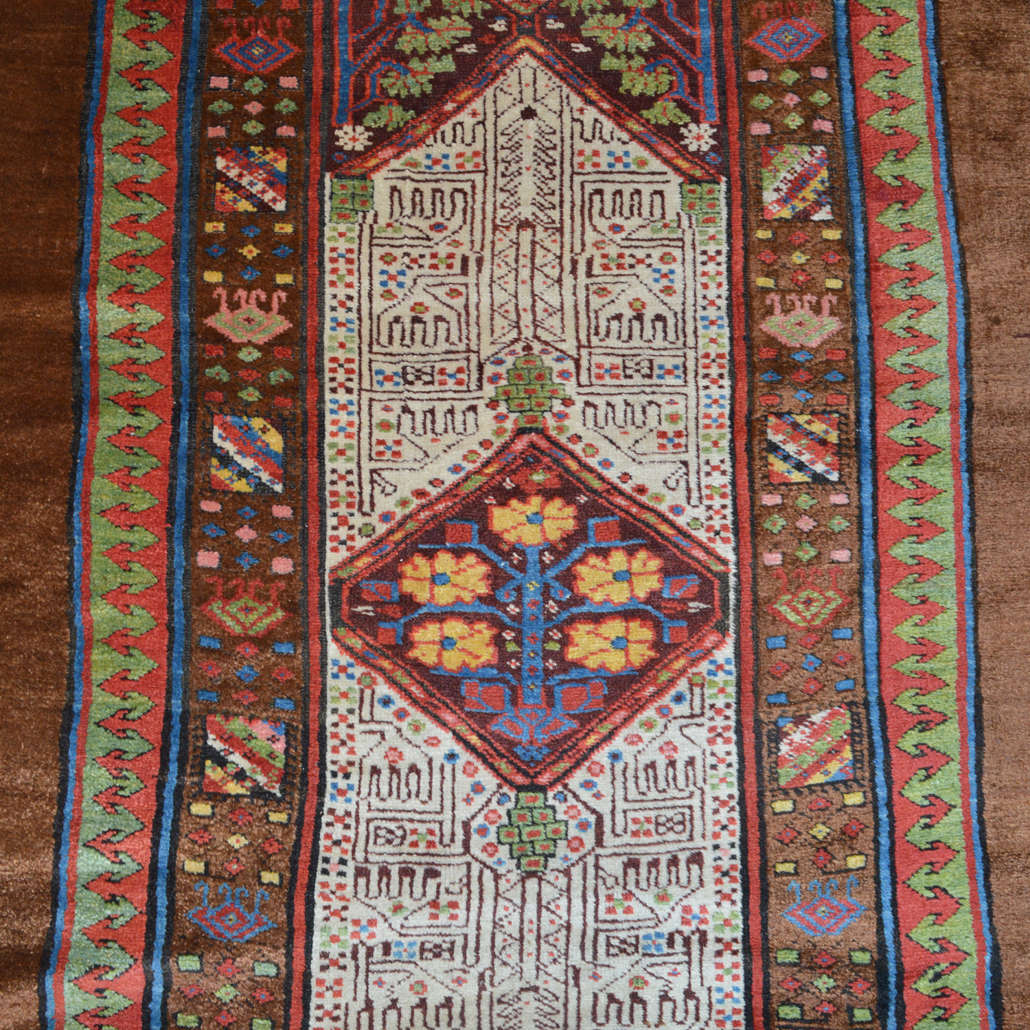 Detail from an antique Persian Serab runner with an ivory field, circa 1880