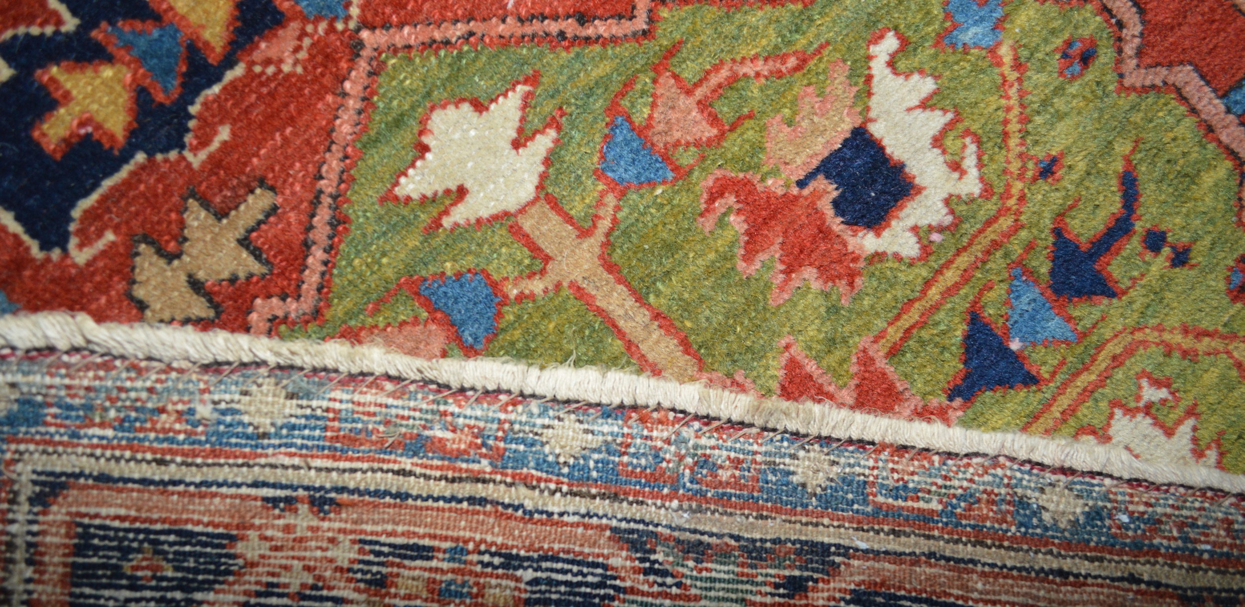 Weave detail of an antique Karaja rug with a light green medallion and terra cotta color field, northwest Persia, circa 1910