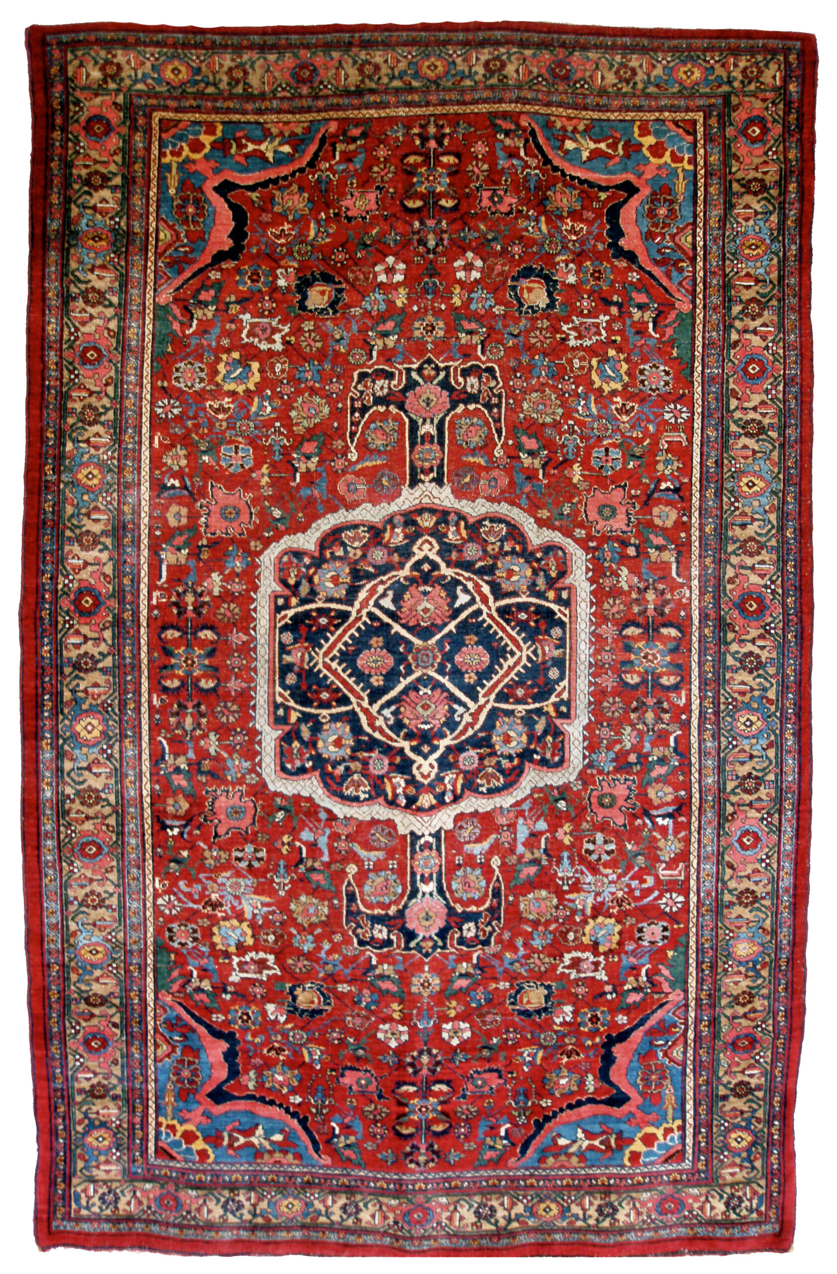 A 19th century northwest Persian Bidjar rug with a navy medallion on a red, floral design field
