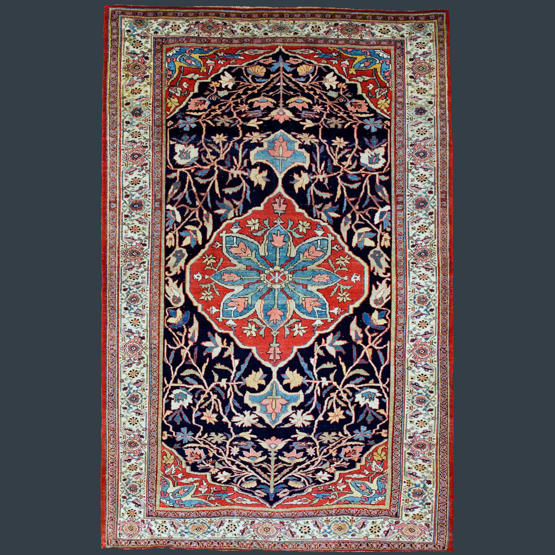 Antique Persian Bidjar rug with a red and sky blue medallion on a navy blue field, framed by an ivory Turtle design border, northwest Persia, circa 1880