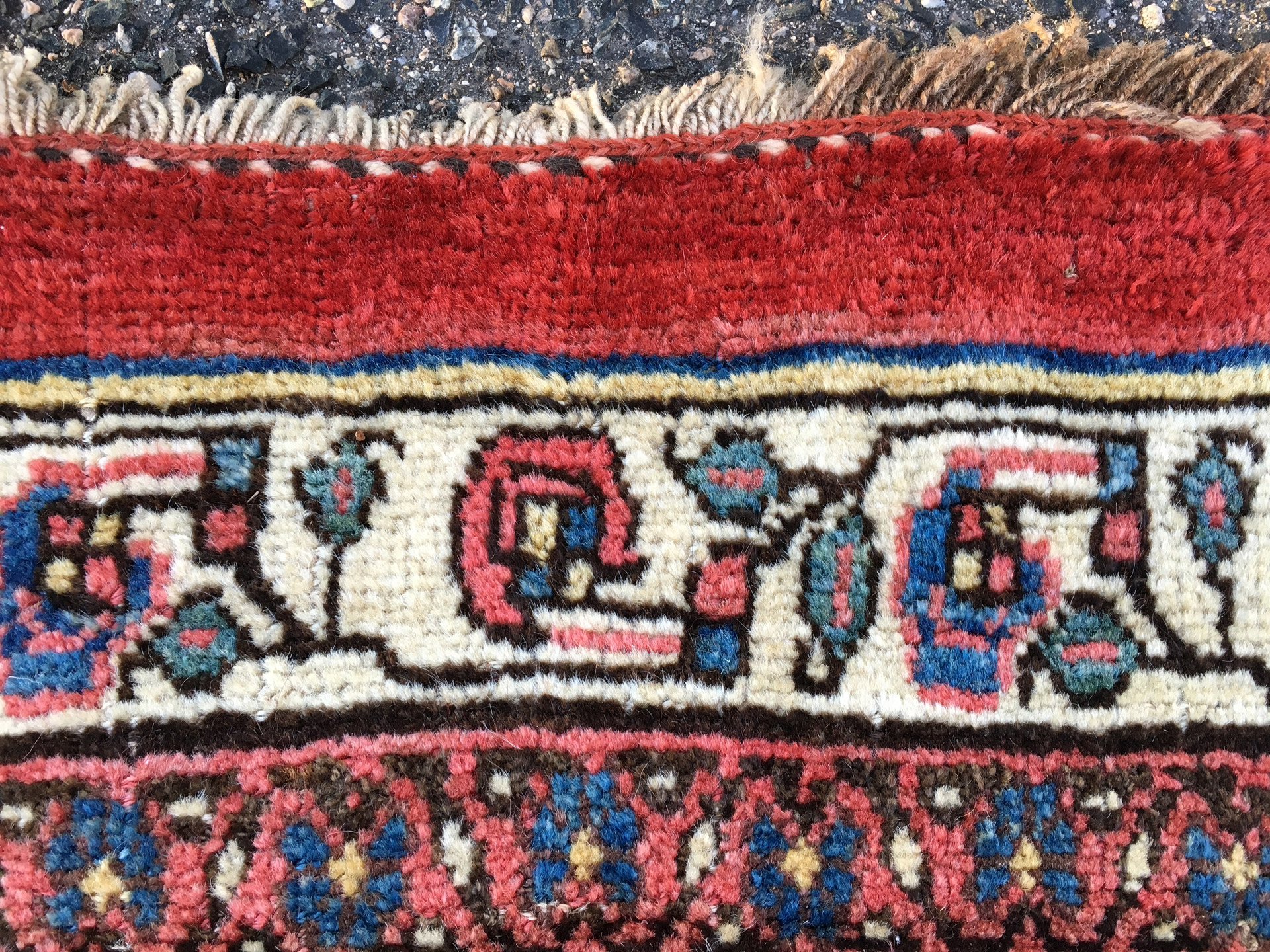 End finish detail from an antique northwest Persian Bidjar carpet