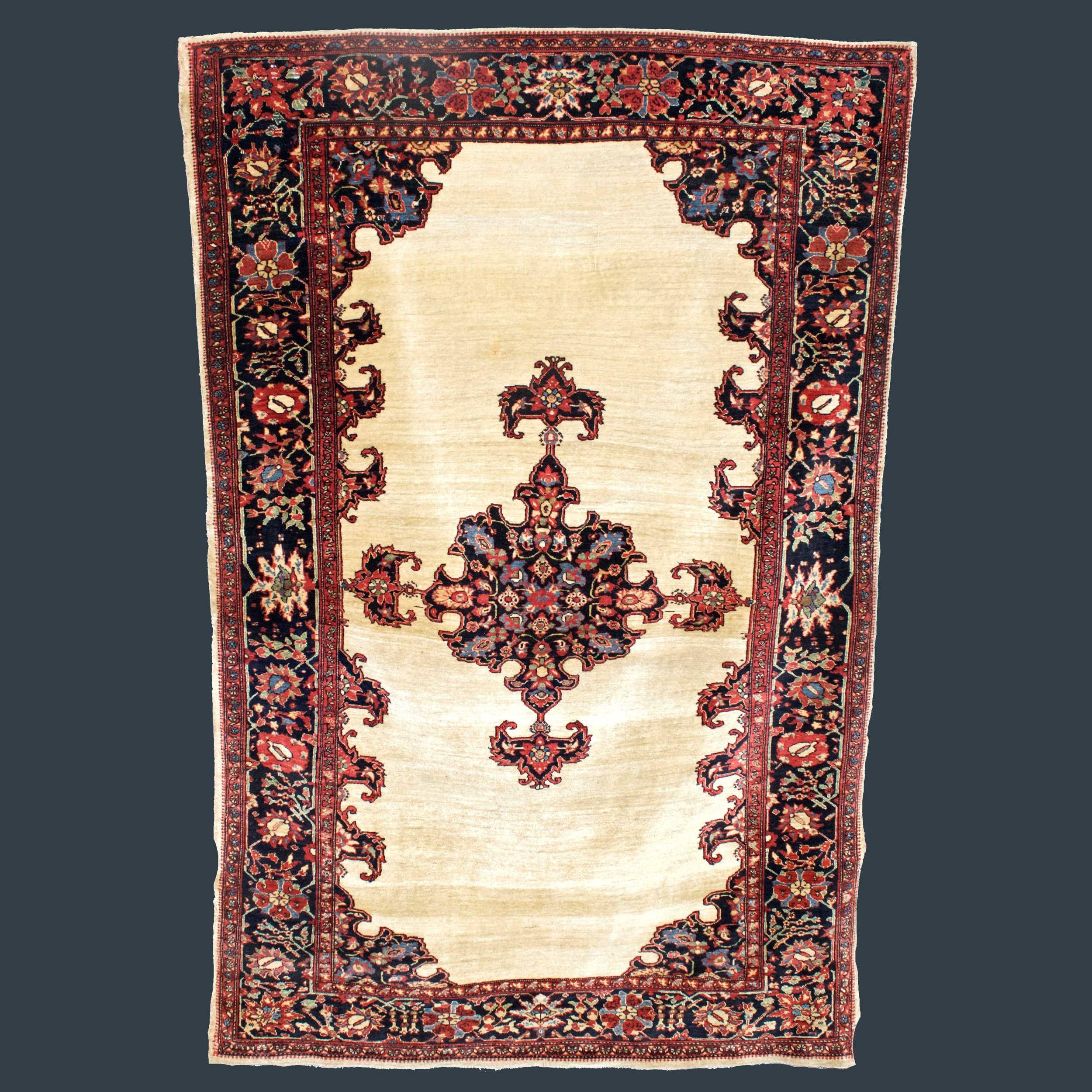 Antique Fereghan Sarouk rug with a navy blue medallion on an ivory open field, central Persia, circa 1885 - Douglas Stock Gallery Antique Oriental Rug Research Archives
