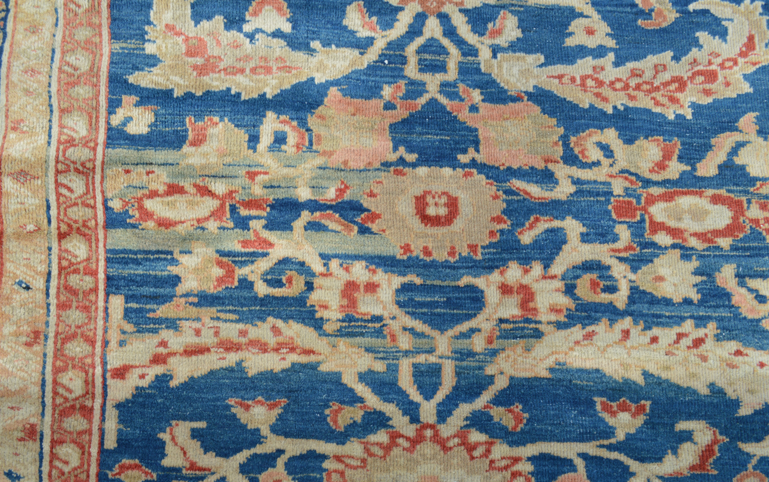 Detail of beautiful abrash (variegated color produced by changes in dye lots) in a 19th century Persian Sultanabad carpet - Douglas Stock Gallery, antique Oriental rugs