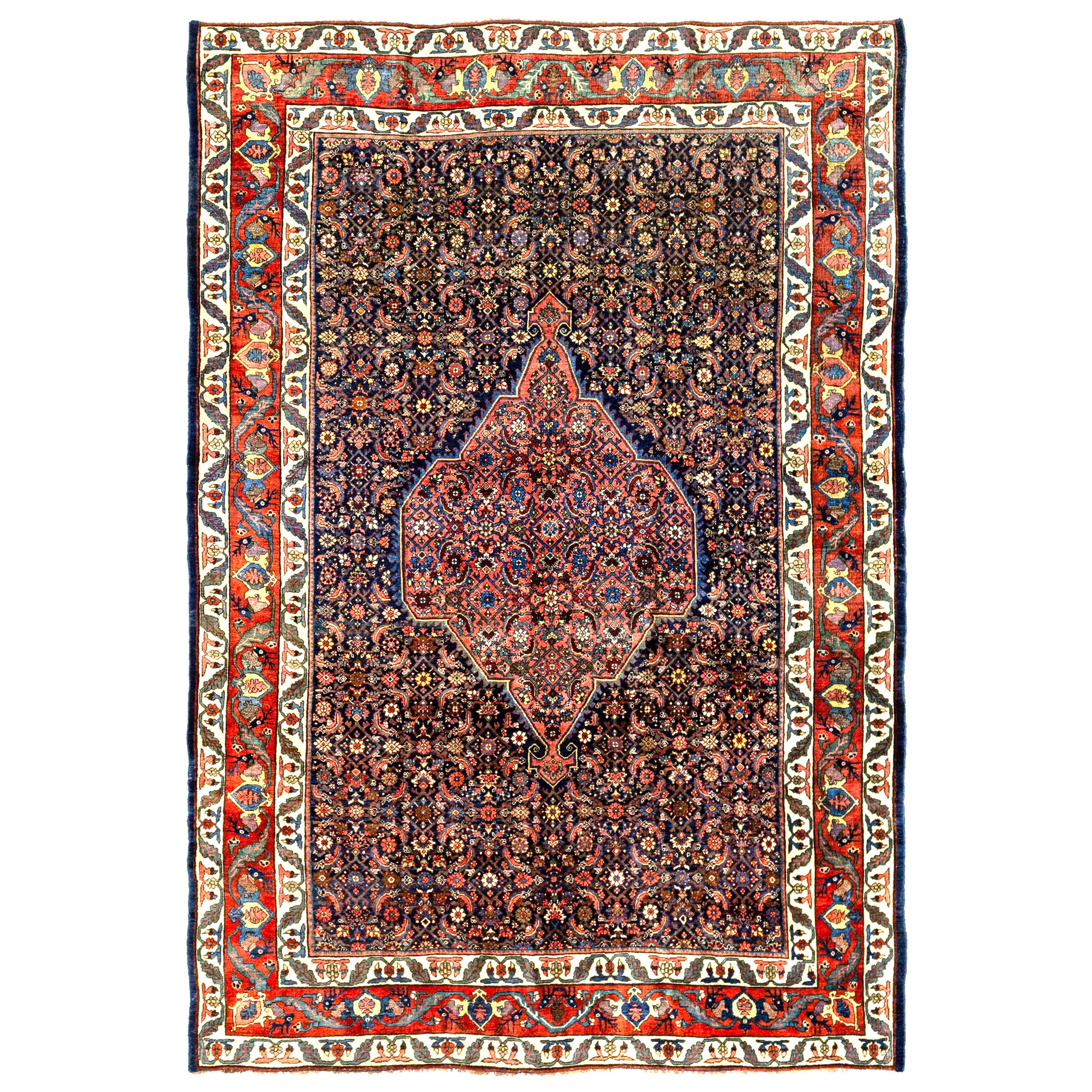 An antique Persian Bidjar carpet with a light rose color medallion on a navy blue field that is decorated with the classical "Herati" design. A red border with the famous deer head design and ivory guard borders frame the field, northwest Persia, Kurdistan province, circa 1895. Douglas Stock Gallery specializes in antique Persian Bidjar rugs and room size Bidjar carpets.