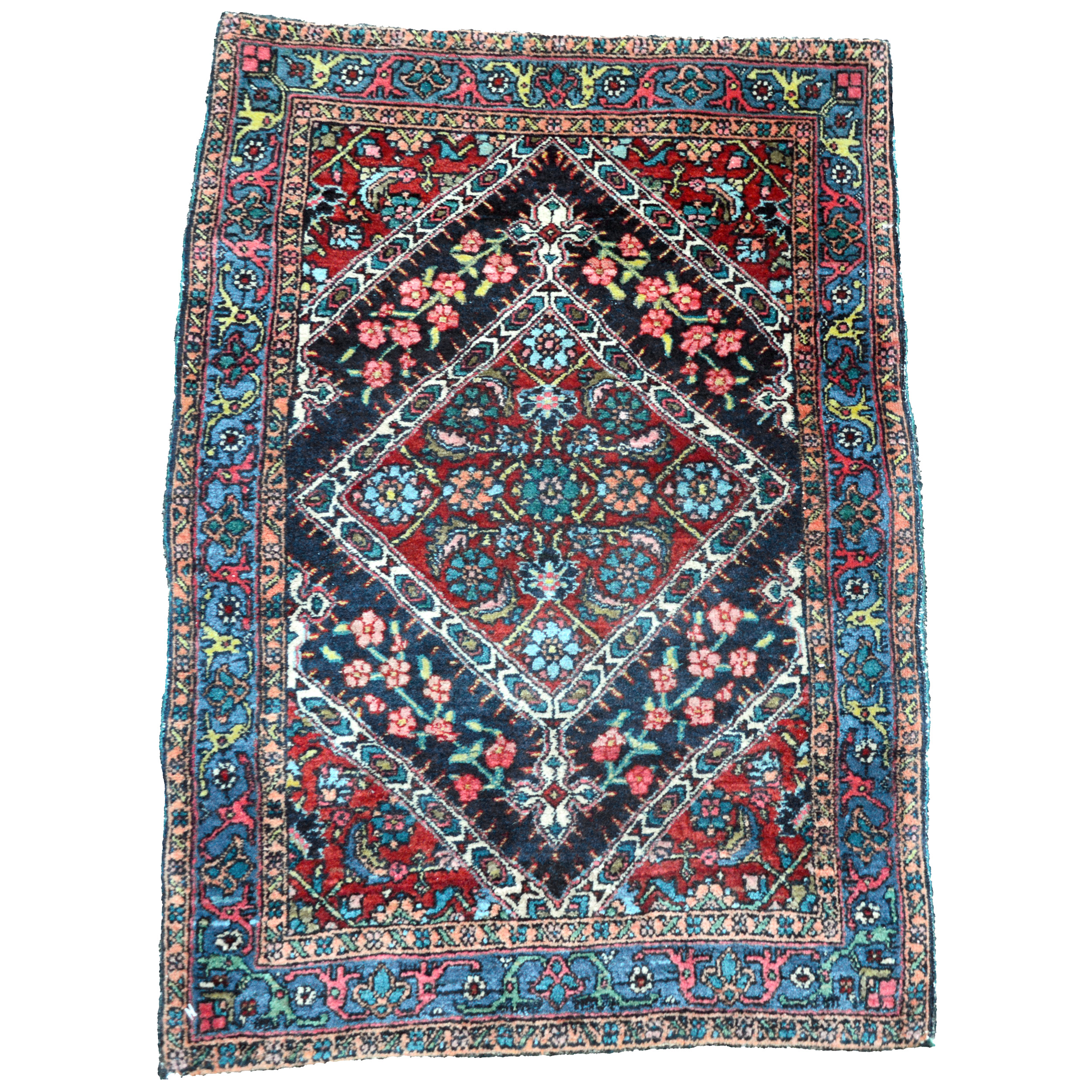 Antique Persian Bidjar Mat or Poshti, terms for small rugs approximately two feet by three feet in size. The navy blue field contains a red medallion and is framed by a deep sky blue border. Northwest Persia, circa 1915. Douglas Stock Gallery, antique Persian rugs Boston,MA area, New England