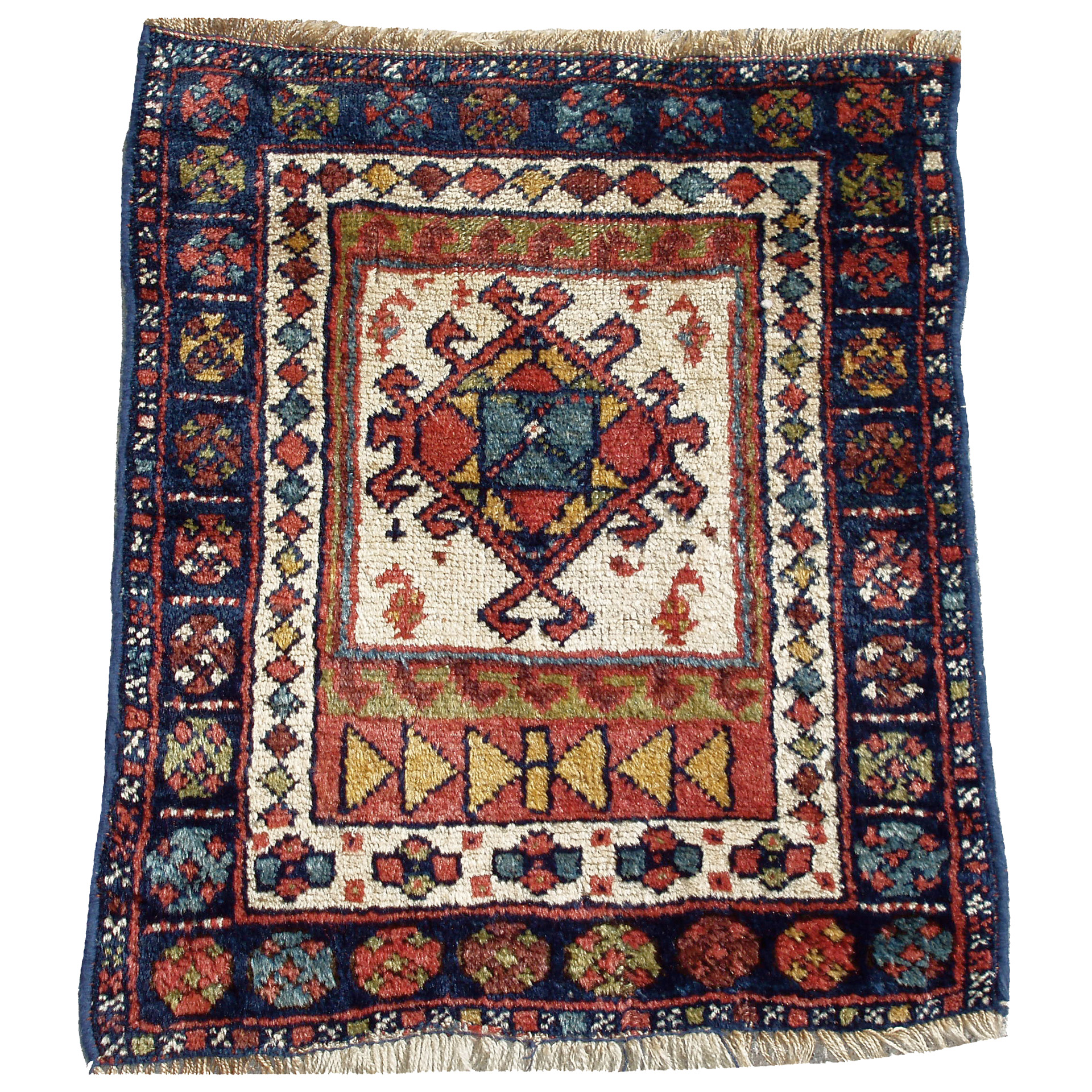 From our Douglas Stock Gallery antique Oriental rug research archives, an antique northwest Persian Kurdish bagface with an ivory field, circa 1900