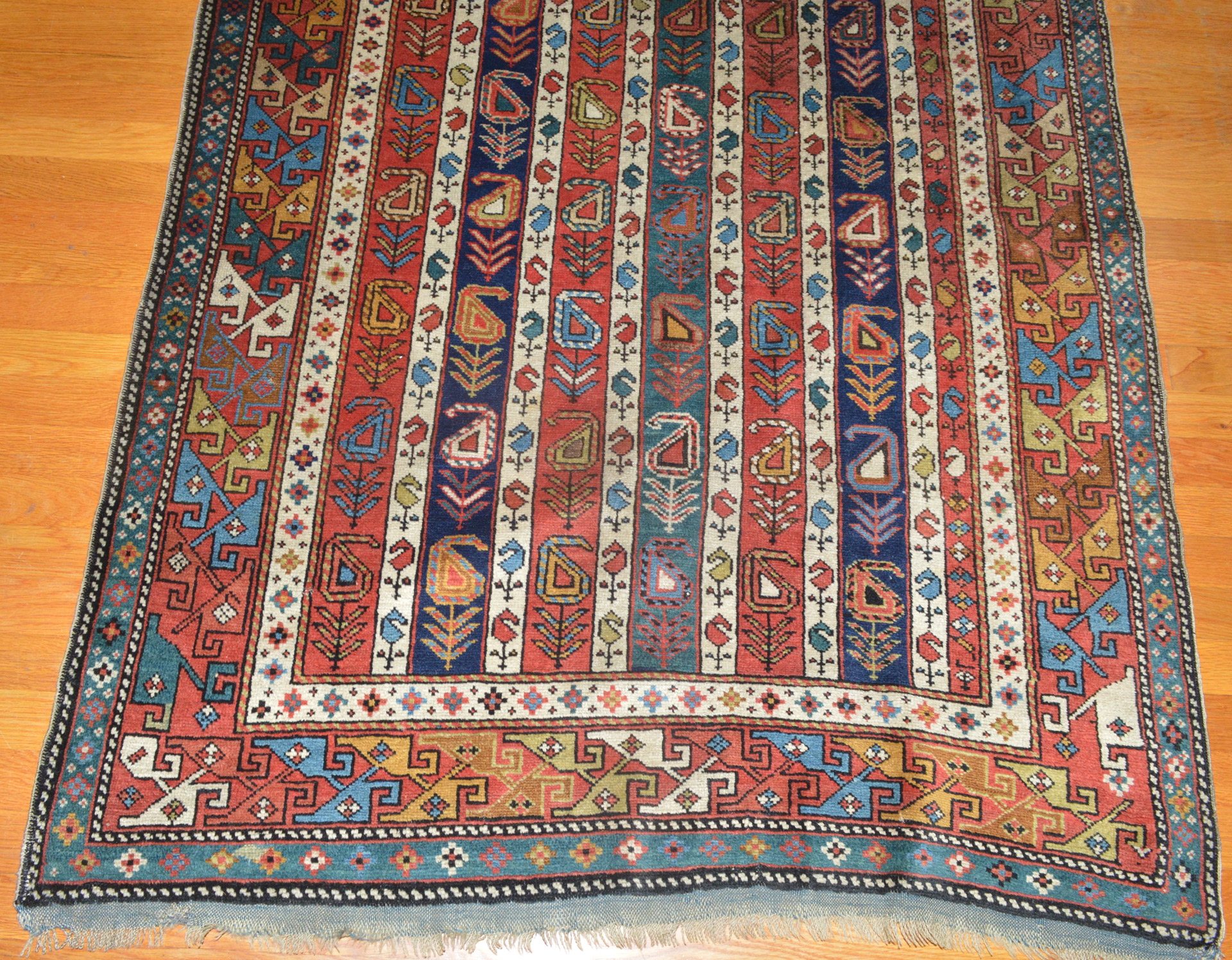 Field and border detail from an antique Caucasian Shirvan long rug with vertical stripes and Both (Paisley shaped motifs) - Douglas Stock Gallery antique Oriental rugs, South Natick (Boston area),MA - antique tribal rugs, antique Caucasian rugs, one of New England's finest sources for antique Oriental rugs