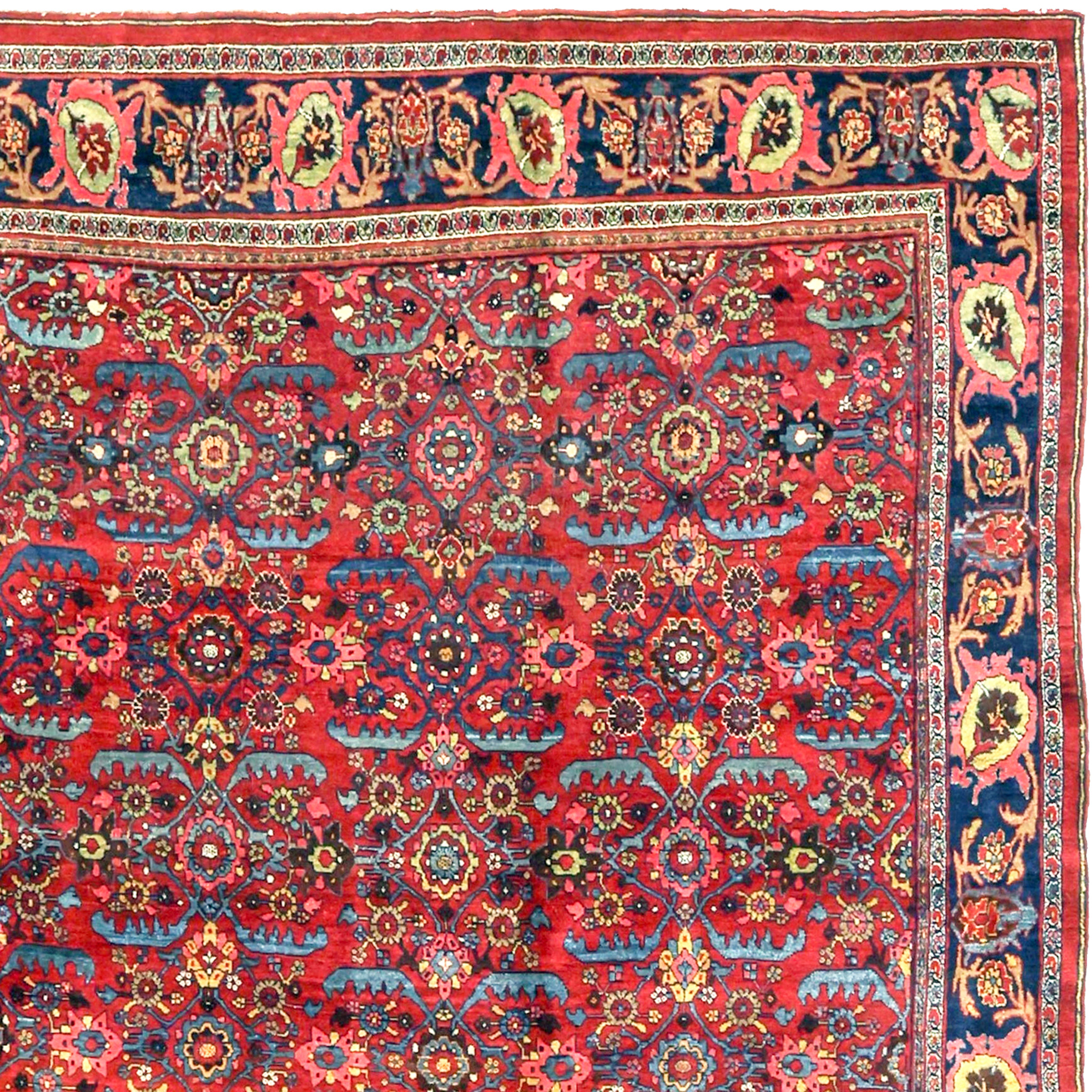 An antique Persian Bidjar carpet of the Gerus type. The red field is decorated with an all-over design of light blue leaves and flowerheads within a diamond motif forming a sort of modified "Herati" design. Northwest Persia, Kurdistan province, circa 1900. Douglas Stock Gallery specializes in antique Persian Bidjar rugs and room size Bidjar carpets. Antique Bidjar carpets Boston,MA area New England.Antique Bidjar carpets NYC by appointment, antique Bidjar carpets Washington,DC by appointment.