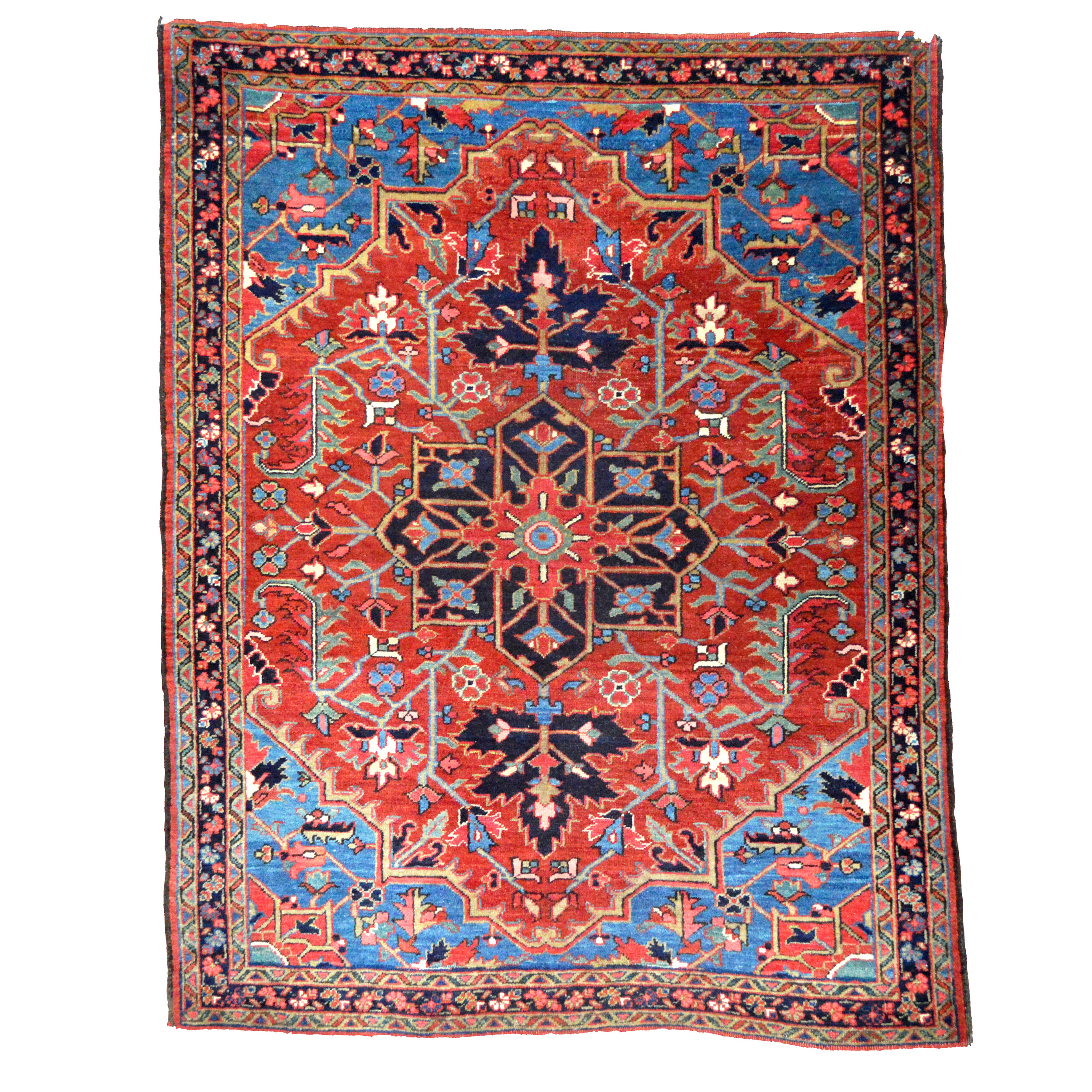 a small antique Persian Heriz rug with a navy blue medallion on a deep salmon color field that is framed by denim blue spandrels and a navy border - Douglas Stock Gallery, antique Oriental rugs, South Natick, Wellesley, Newton, Brookline, Boston,MA area