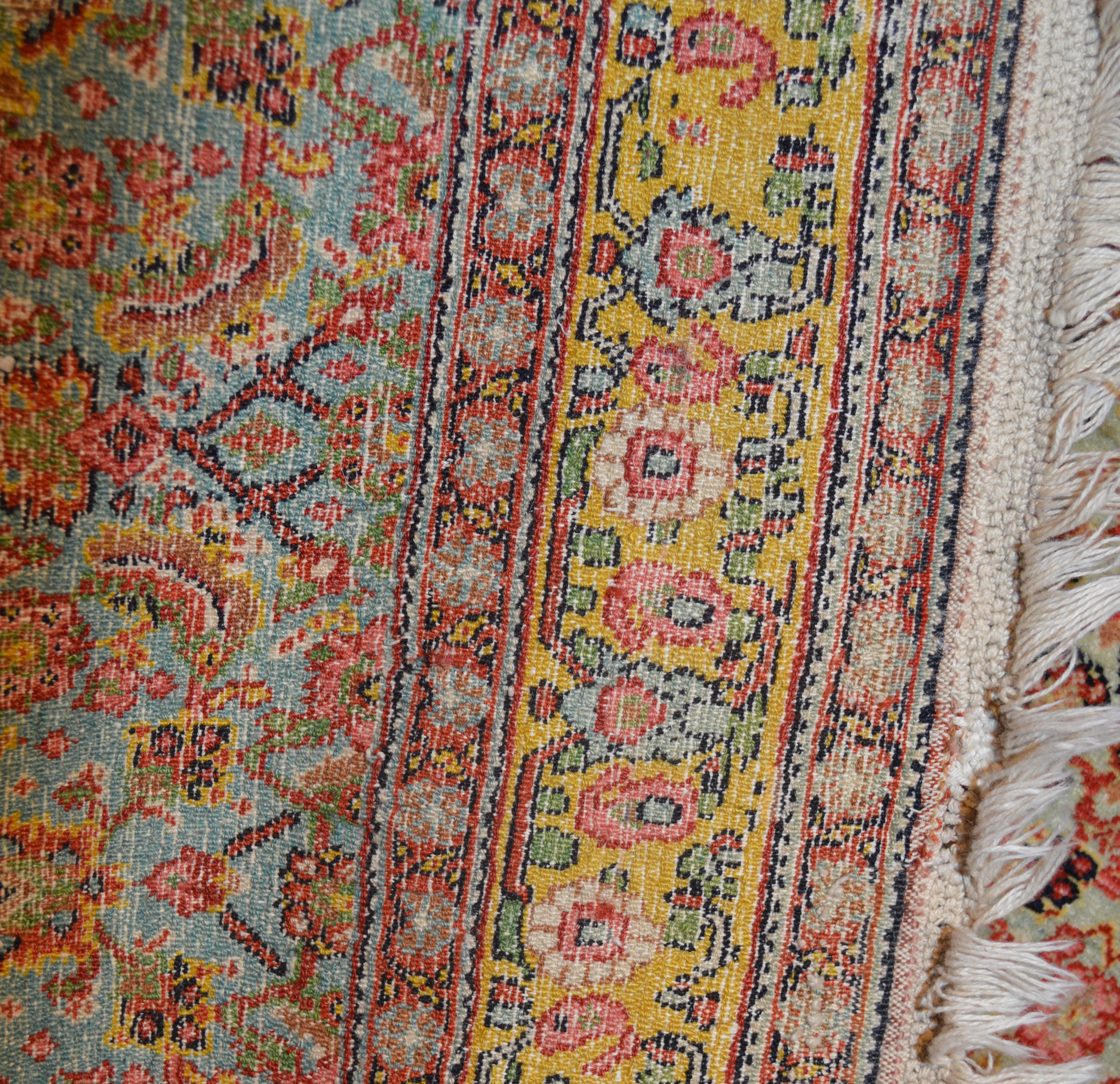 Weave detail of a fine antique Persian Senneh rug with a light blue, Herati design field framed by a yellow border - Douglas Stock Gallery, antique rugs Boston,MA area, New England