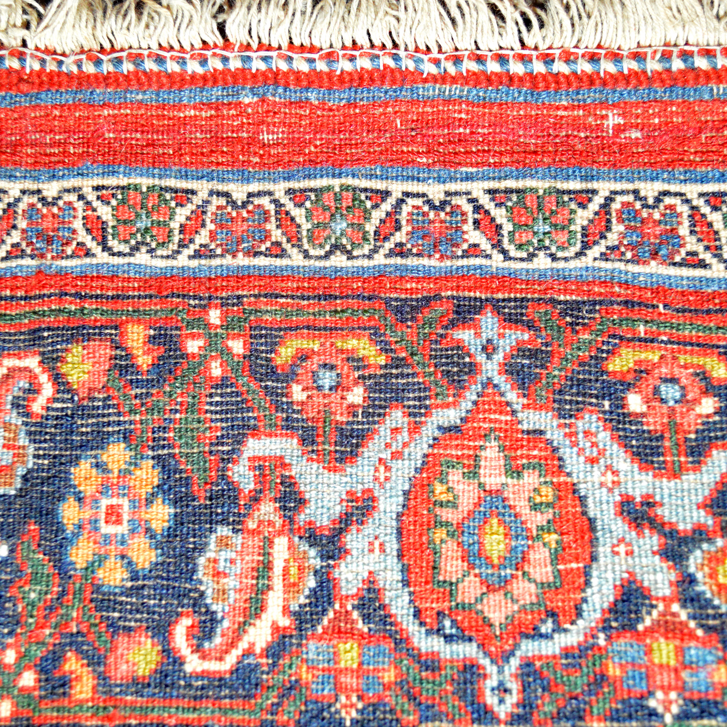 Weave detail from a finely woven antique Persian Halvai Bidjar rug with a red, Herati design field and a navy blue Turtle border, circa 1920, northwest Persia - Douglas Stock Gallery, antique Persian rugs Boston,MA area, antique rugs New England
