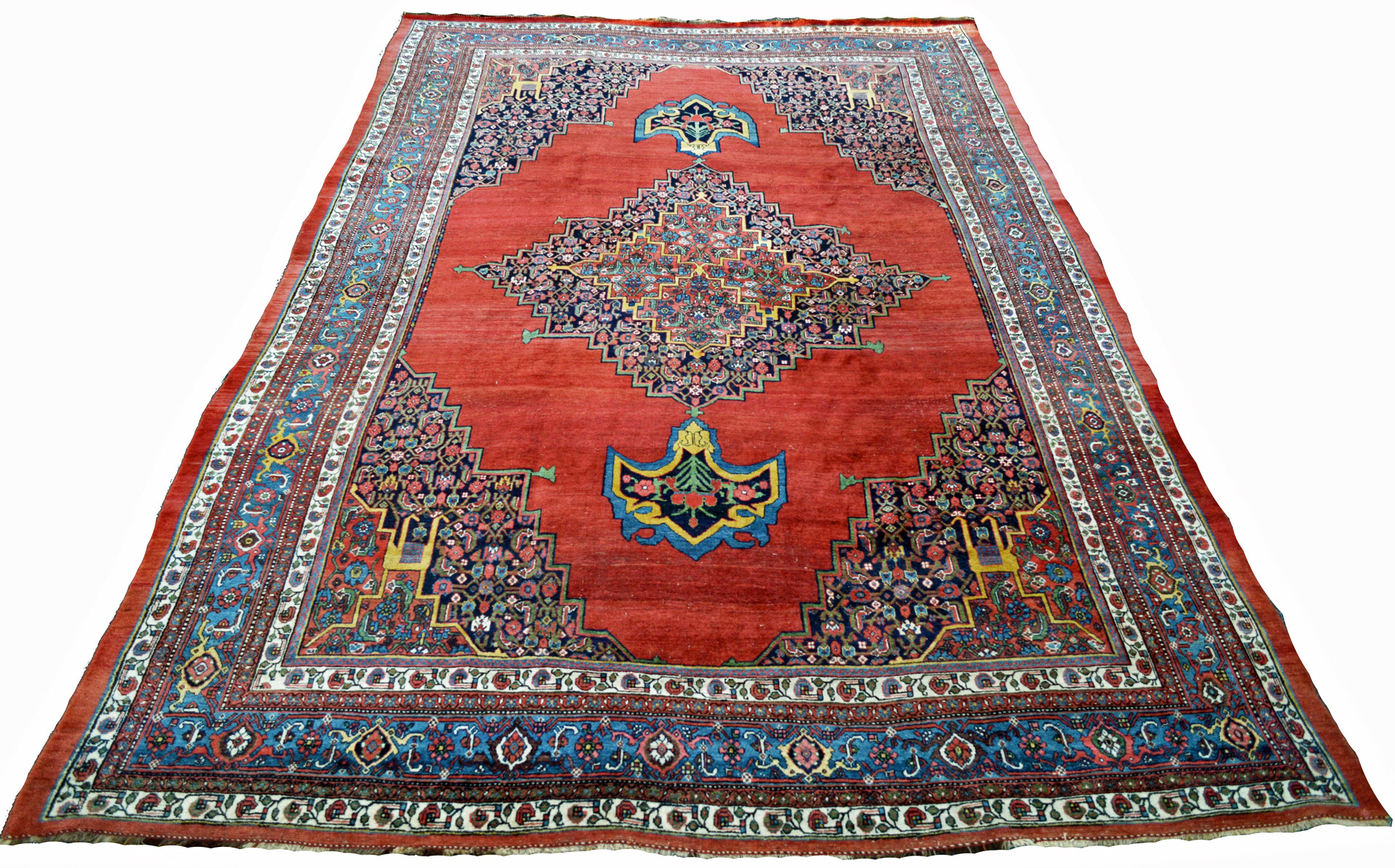 A room size antique Persian Bidjar carpet with a navy medallion with anchor pendants on a red open field. Northwest Persia, circa 1890 - Douglas Stock Gallery, antique Oriental rugs South Natick, Wellesley, Weston, Newton, Brookline, Boston,MA area, antique rugs New England USA