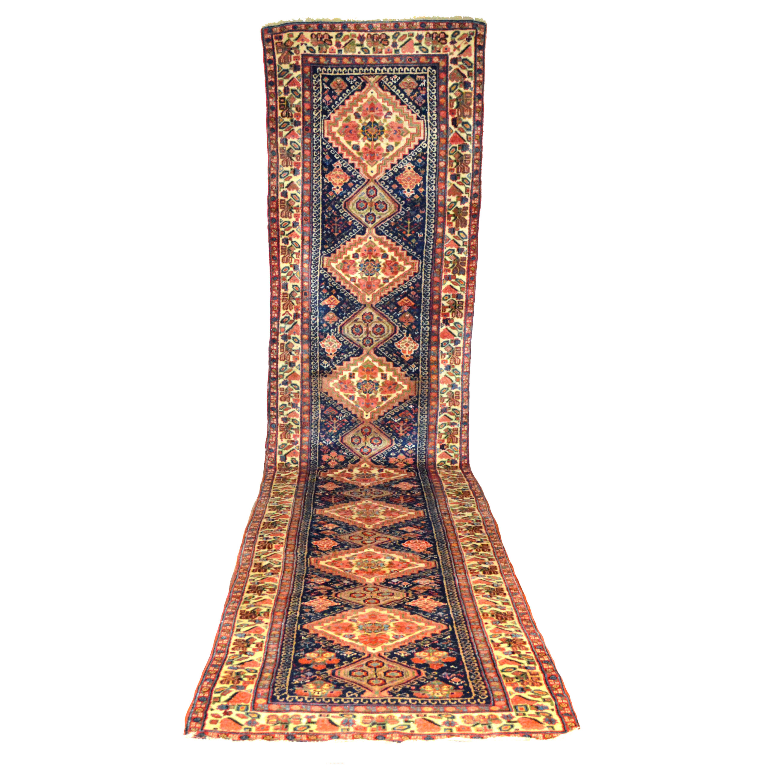 Douglas Stock Gallery is one of America's most selective dealers in antique Oriental rugs, Boston,MA area, South Natick,MA, antique northwest Persian runner with medallions on a navy blue field that is framed by an ivory border