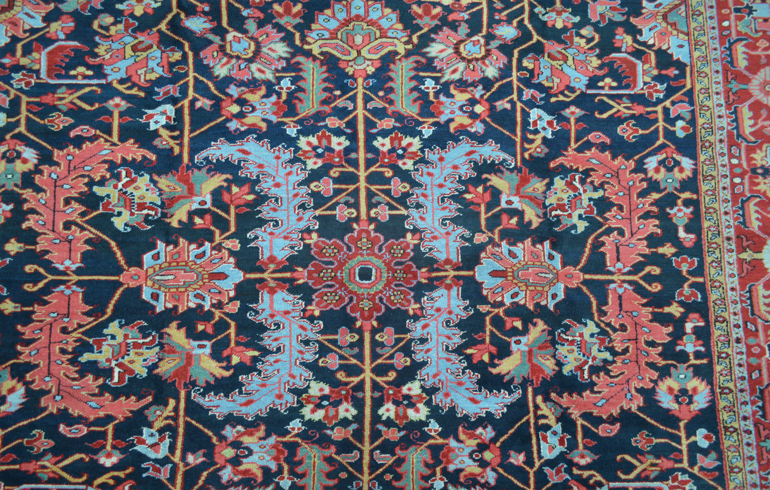 Field detail from an antique Persian Heriz carpet with large leaves on a navy blue field, Douglas Stock Gallery, antique Oriental rugs