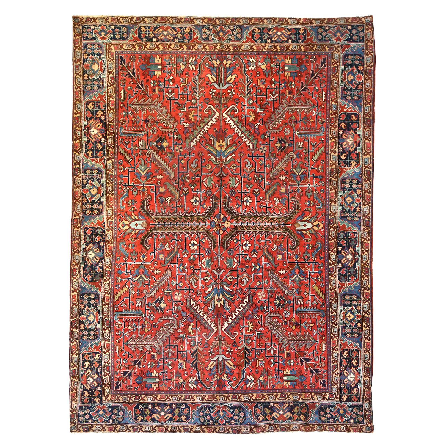 An antique Persin Heriz carpet with an all-over design of large leaves and ancillary stylized flowers on a deep salmon color field. A well drawn navy blue major border with yellow guard border frames the field. Douglas Stock Gallery, antique Persian carpets Boston,MA area - antique Oriental rugs New England- Heriz carpets