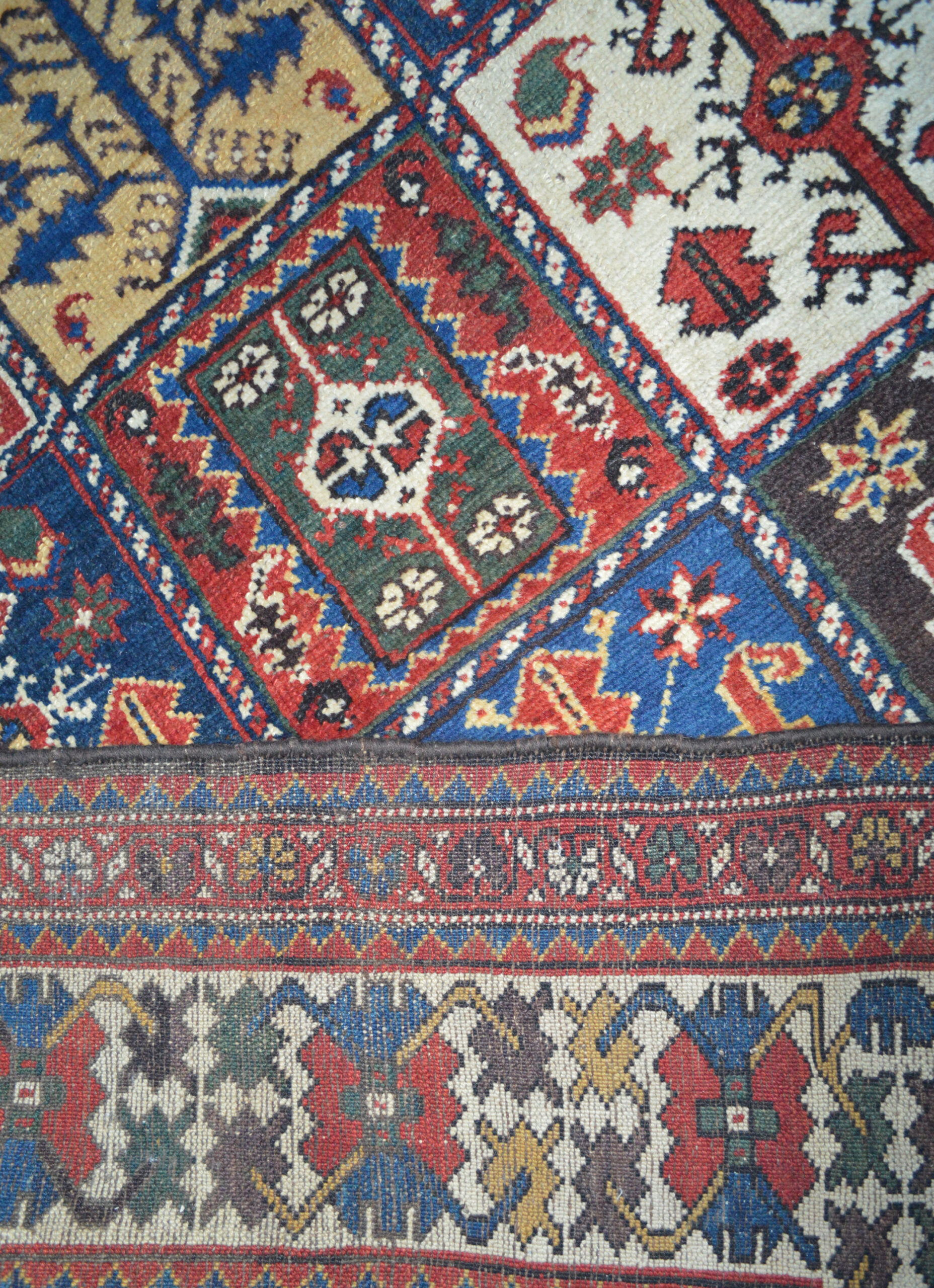 Detail photograph of the weave of an antique Persian Bakhtiyari carpet with a Garden panel design and Crab design border, south Persia, circa 1895, Douglas Stock Gallery, antique carpets Boston,MA area, antique carpets New England