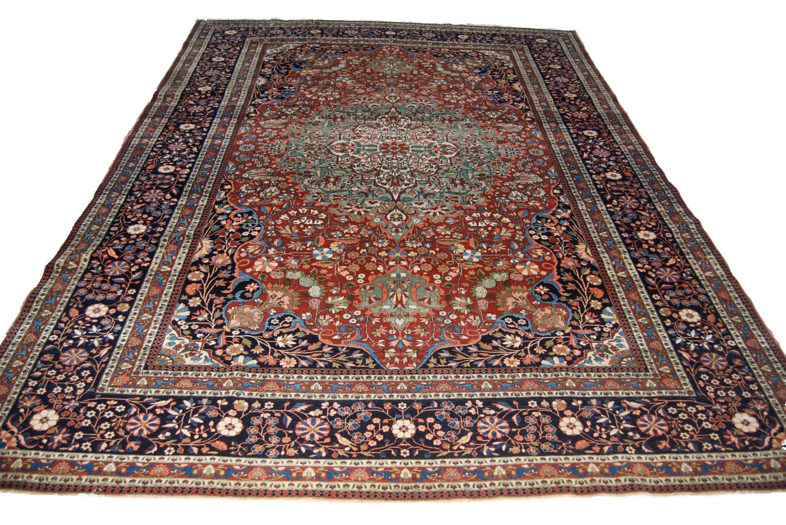 Antique Persian Mohtasham Kashan carpet with a green medallion on a brick red field with navy corner spandrels and a navy blue border, Douglas Stock Gallery, antique Persian carpets, antique Oriental rugs Boston,MA area