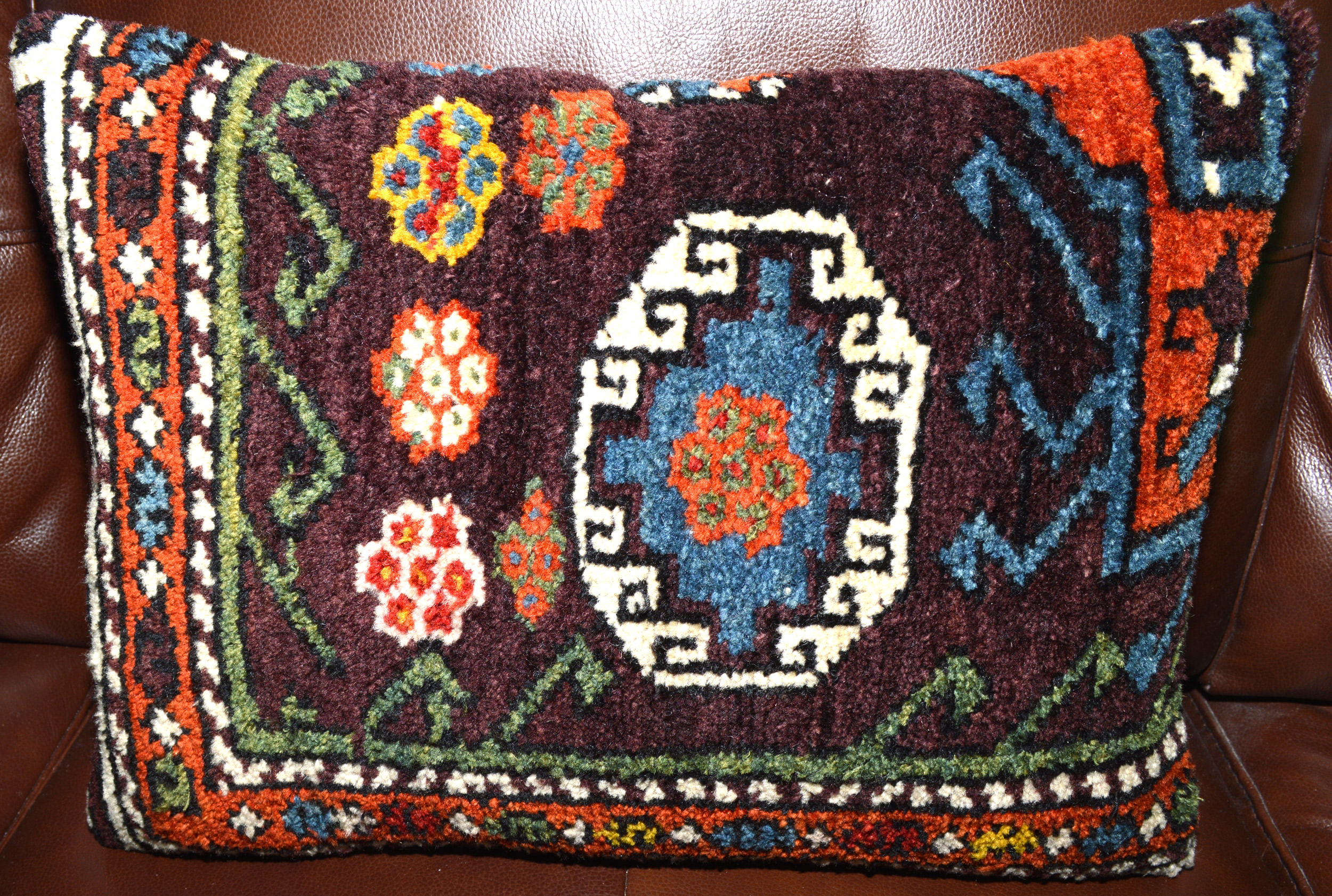 Antique Turkish rug fragment pillow with aubergine color field and Memling gel design, Douglas Stock Gallery, antique Oriental rugs, carpets, pillows Boston,MA area New England