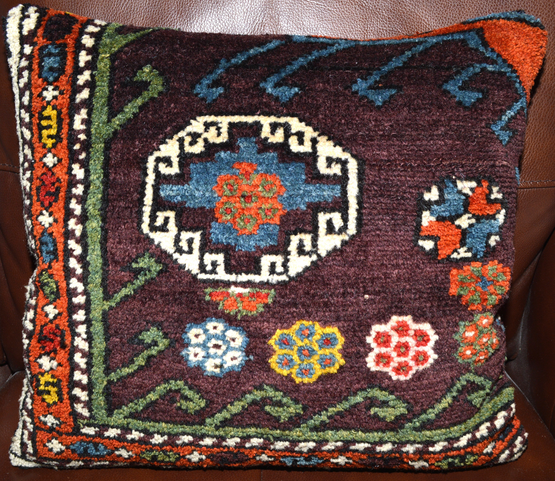 18" x 16" antique Turkish rug pillow made from a fragment of an antique Canakkale / Bergama rug, late 19th century. Douglas Stock Gallery offers a selection of antique Oriental rug pillow, antique rug cushions, Douglas Stock Gallery works with individual clients, architects and interior designers and is based in historic South Natick,MA in the Boston area. Antique rugs New England.