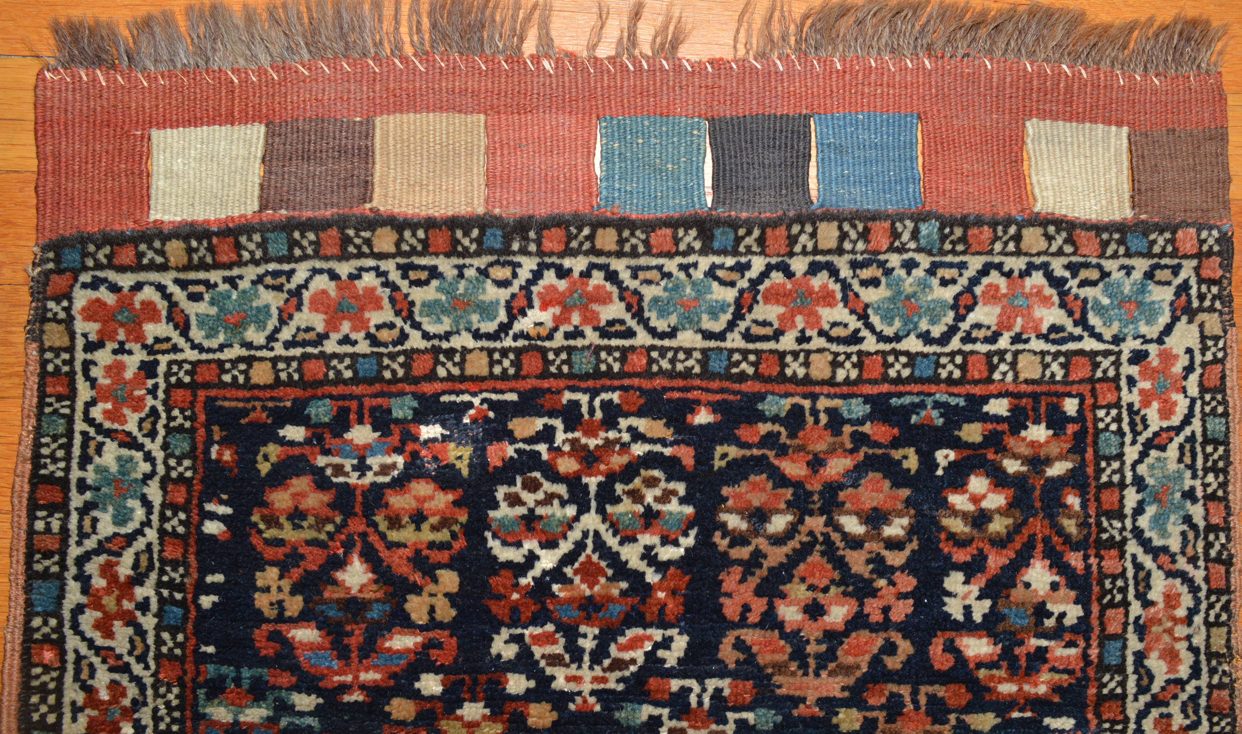 Field detail and flat woven kilim closure tabs from an antique Shah Savan or Kurdish bag face. Douglas Stock Gallery, antique collectible rugs and antique Oriental bags and saddle bags, antique rugs Boston,MA area New England
