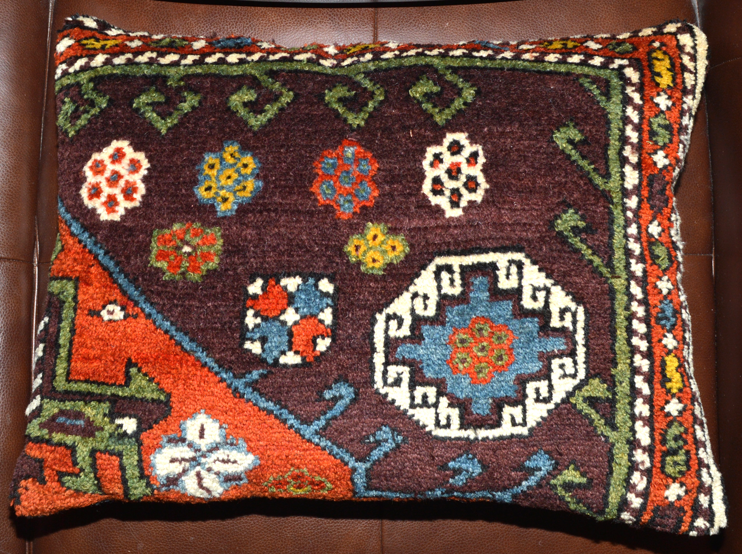 21" x 15" antique Turkish rug fragment pillow # 6, made from a fragment of a 19th century Turkish Canakkale / Bergama rug with an aubergine color field and decorated with a Memling Gul, Douglas Stock Gallery, antique Oriental rugs Boston, Brookline, Weston, Newton, Wellesley, Needham, Dover, Sherborn, South Natick MA area