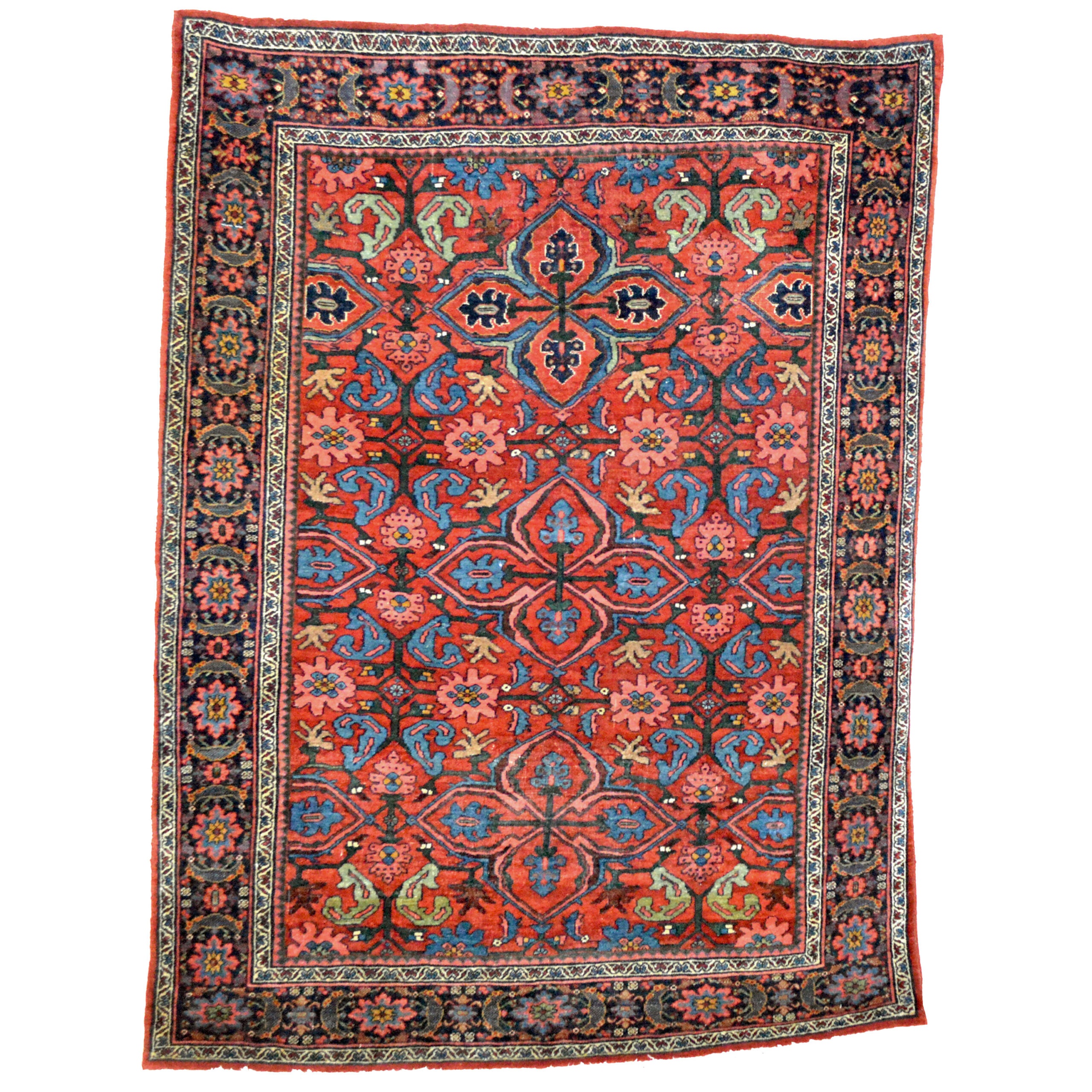 An antique Persian Bidjar rug with a Quatrefoil design on a red field that is framed by a navy blue border with snowflake motifs, northwest Persia, circa 1900 - Boston area based Douglas Stock Gallery is one of America's most selective dealers in antique Oriental rugs including Persian rugs, Caucasian rugs, Turkish rugs and Chinese rugs. Antique Persian rugs Boston, Brookline, Belmont, Concord, Lexington, Weston, Wellesley, Newton, Natick,MA area antique Oriental rugs