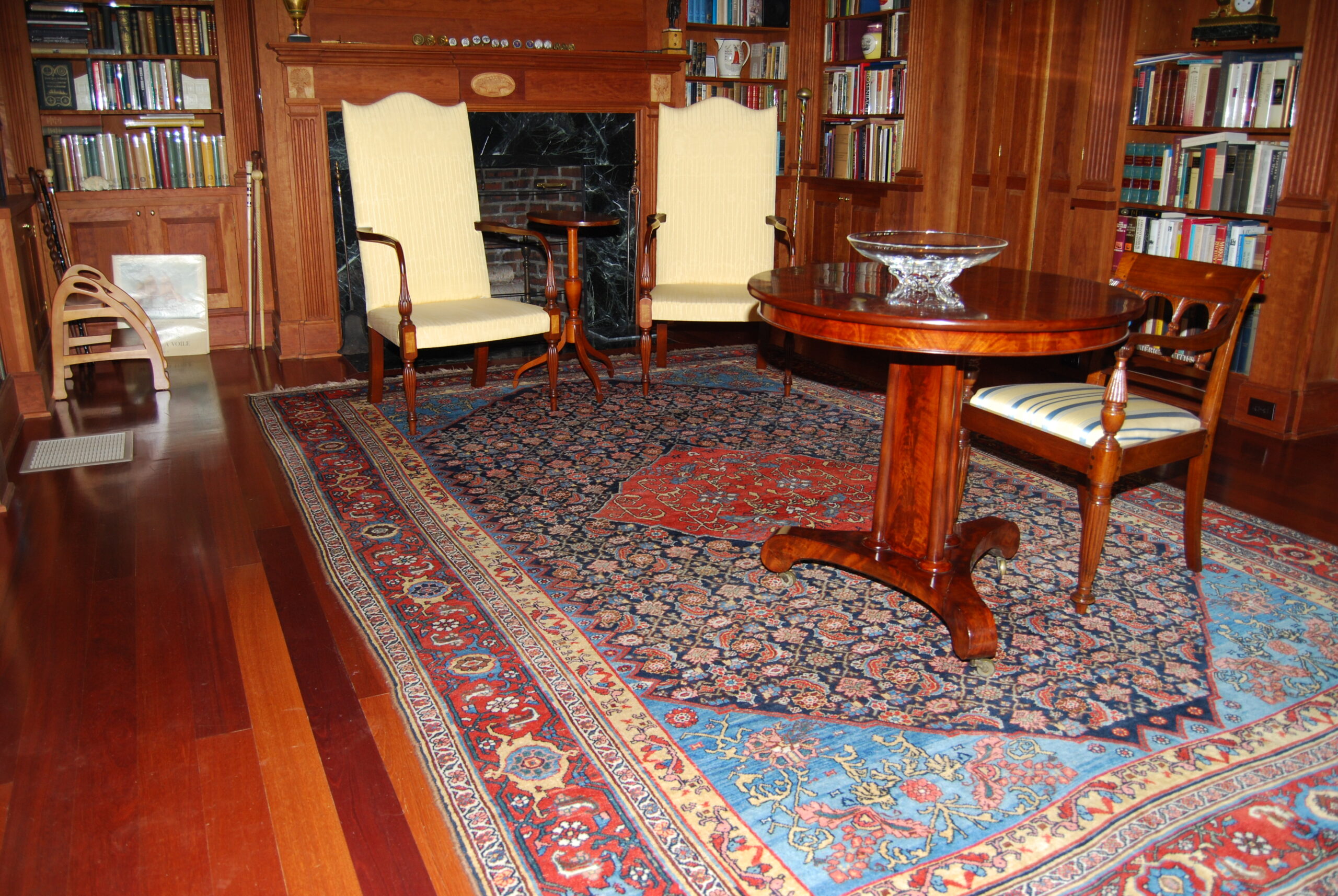 New England family library with antique Persian Bidjar carpet.