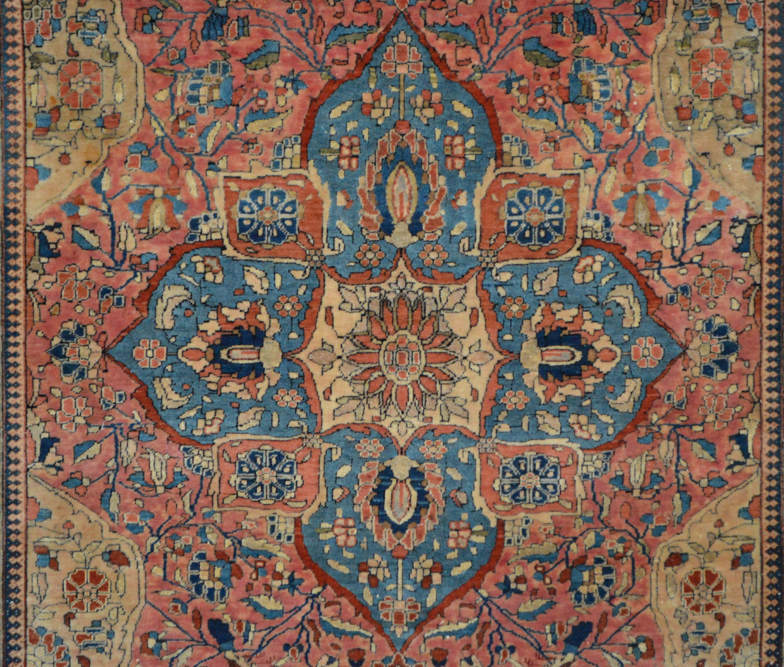 Sky blue Quatrefoil design edallin on a coral color field in an antique Persian Mohtasham Kashan rug, circa 1900, Douglas Stock Gallery specialized in antique Persian Mohtasham kashan rugs and Fereghan Sarouk rugs