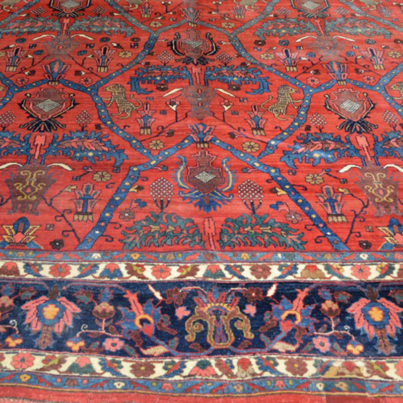 Detail of an antique Persian Bidjar Lion carpet with Lions, leaves and strapwork decorating a red field that is framed by a navy blue border, circa 1900, Douglas Stock Gallery, antique rugs Boston,MA area, antique carpets New England, antique Persian carpets New York