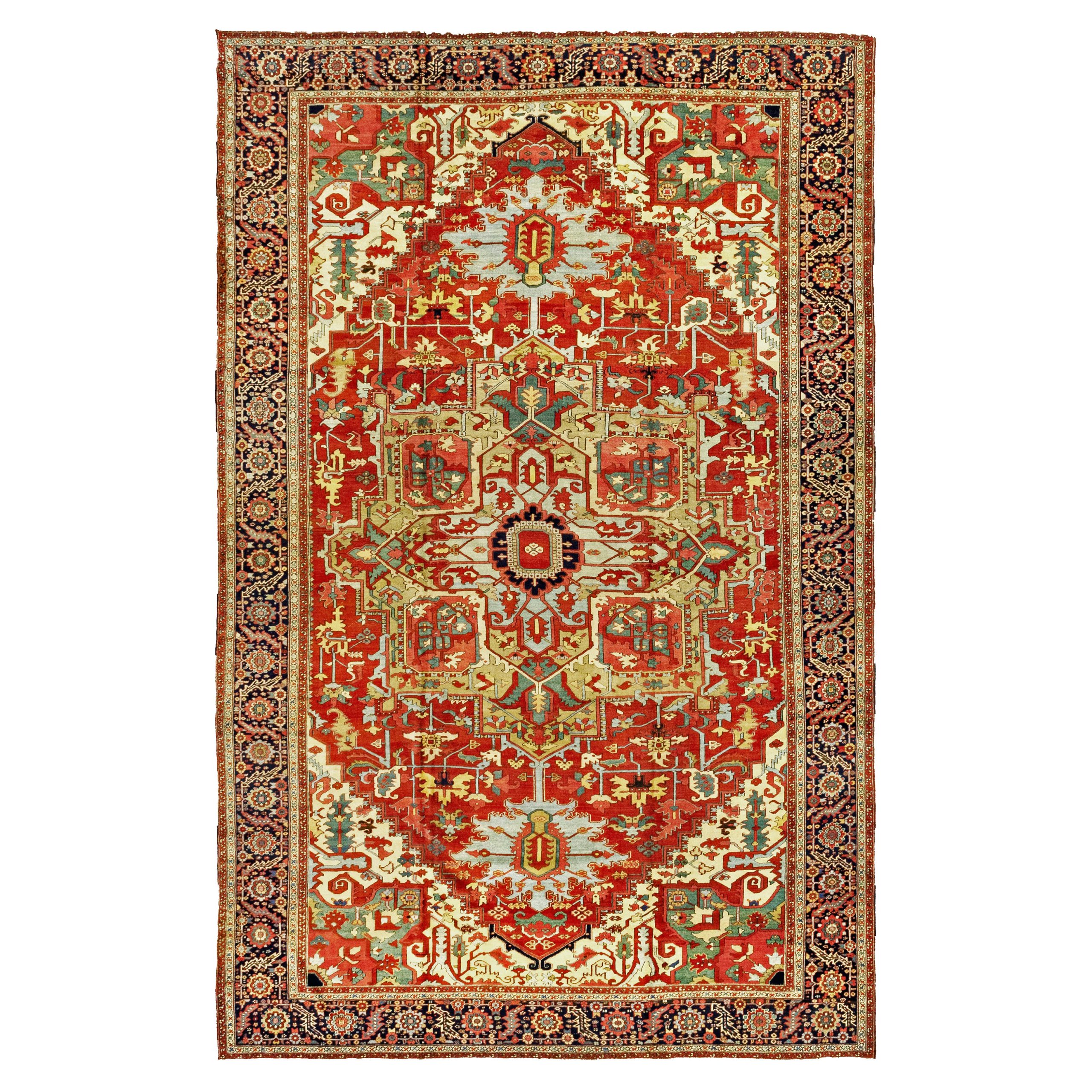 A large antique Persian Heriz "Serapi" carpet with a greenish-camel medallion on a terra cotta color field. Sky blue pendants and stylized floral for,s decorate the field. Ivory corner spandrels with green insets and a navy blue border frame the field. This carpet is published in the January 2026 issue of The Magazine Antiques. Douglas Stock Gallery, antique Persian carpets South Natick,Massachusetts, antique Persian carpets Boston, Brookline, Newton, Concord, Weston, Wellesley, Natick,MA area, antique Persian carpets NYC by appointment, antique Persian carpets Washington,DC, Maryland, Virginia area by appointment
