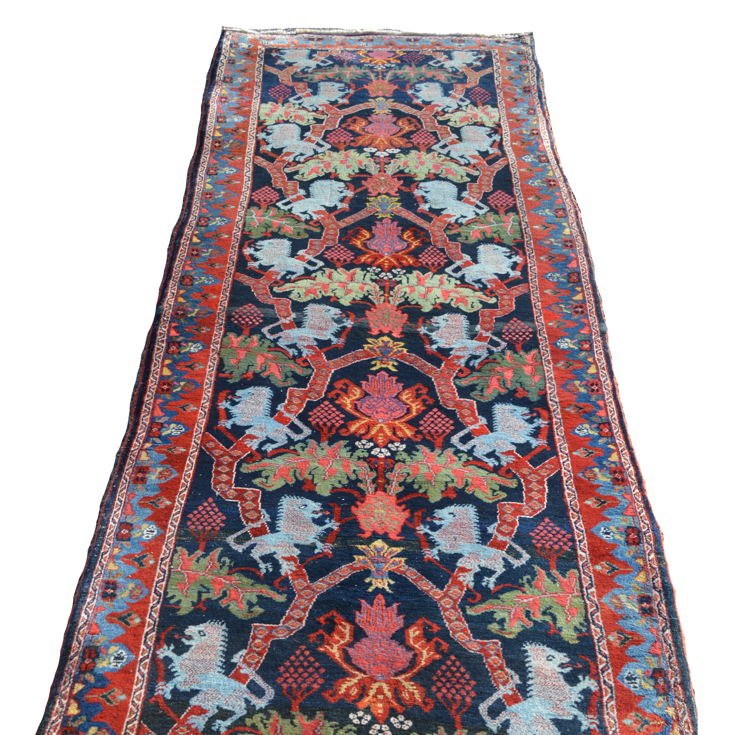 Antique northwest Persian Bidjar Lion Rug in a rare runner format. The navy blue field is decorated with Lions, strapwork, floral forms and leaves. Douglas Stock Gallery specializes in antique Persian Bidjar rugs and other Kurdish weavings from northwest Persia. Antique rugs Boston, Brookline, Newton, Weston, Wellesley, Needham, Natick,MA area, antique Oriental rugs New England, antique Persian runner rugs