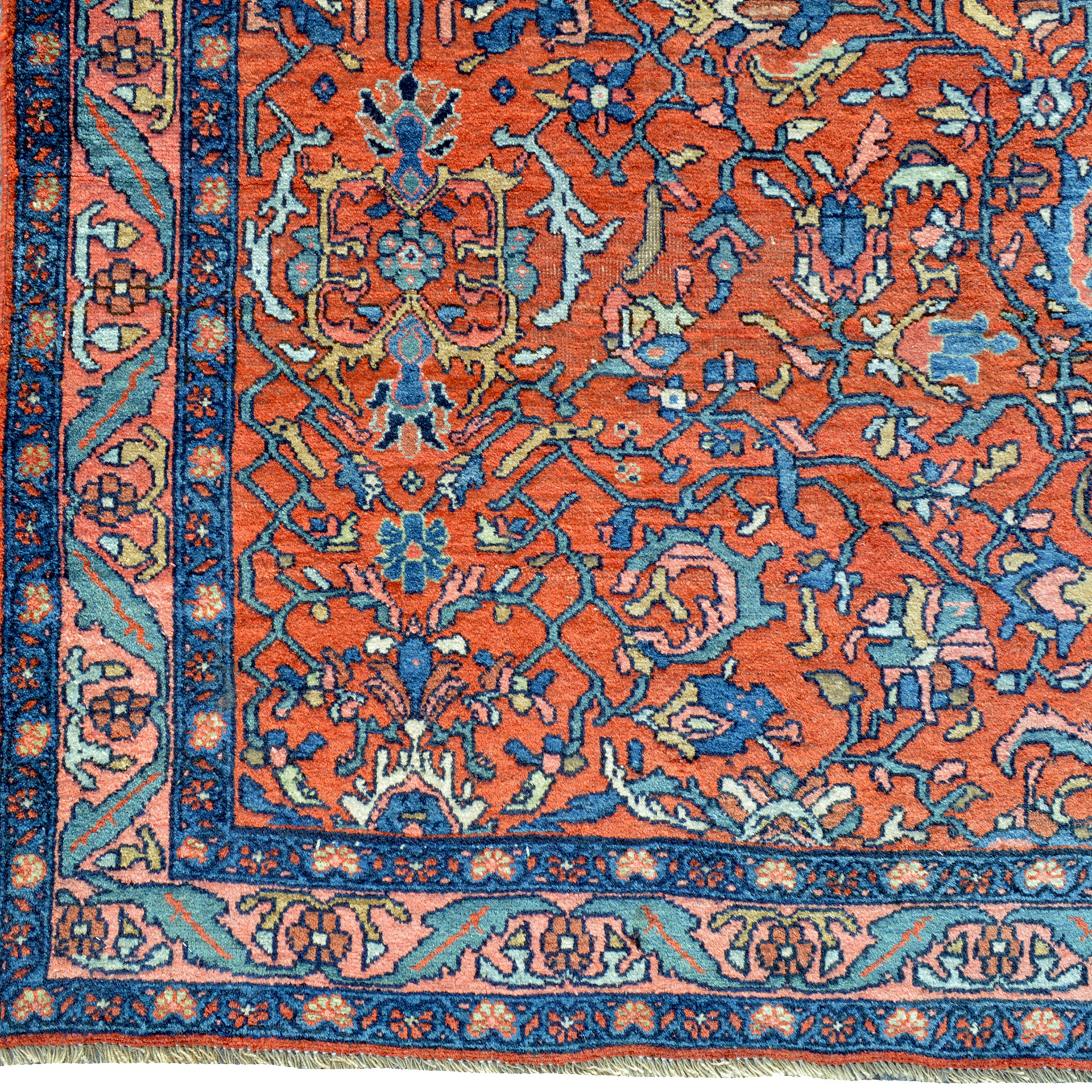 A wide antique Persin Bidjar runner with palmettes and stylized floral forms on a deep salmon color field. Douglas Stock Gallery antique Oriental rugs Boston,MA area South Natick