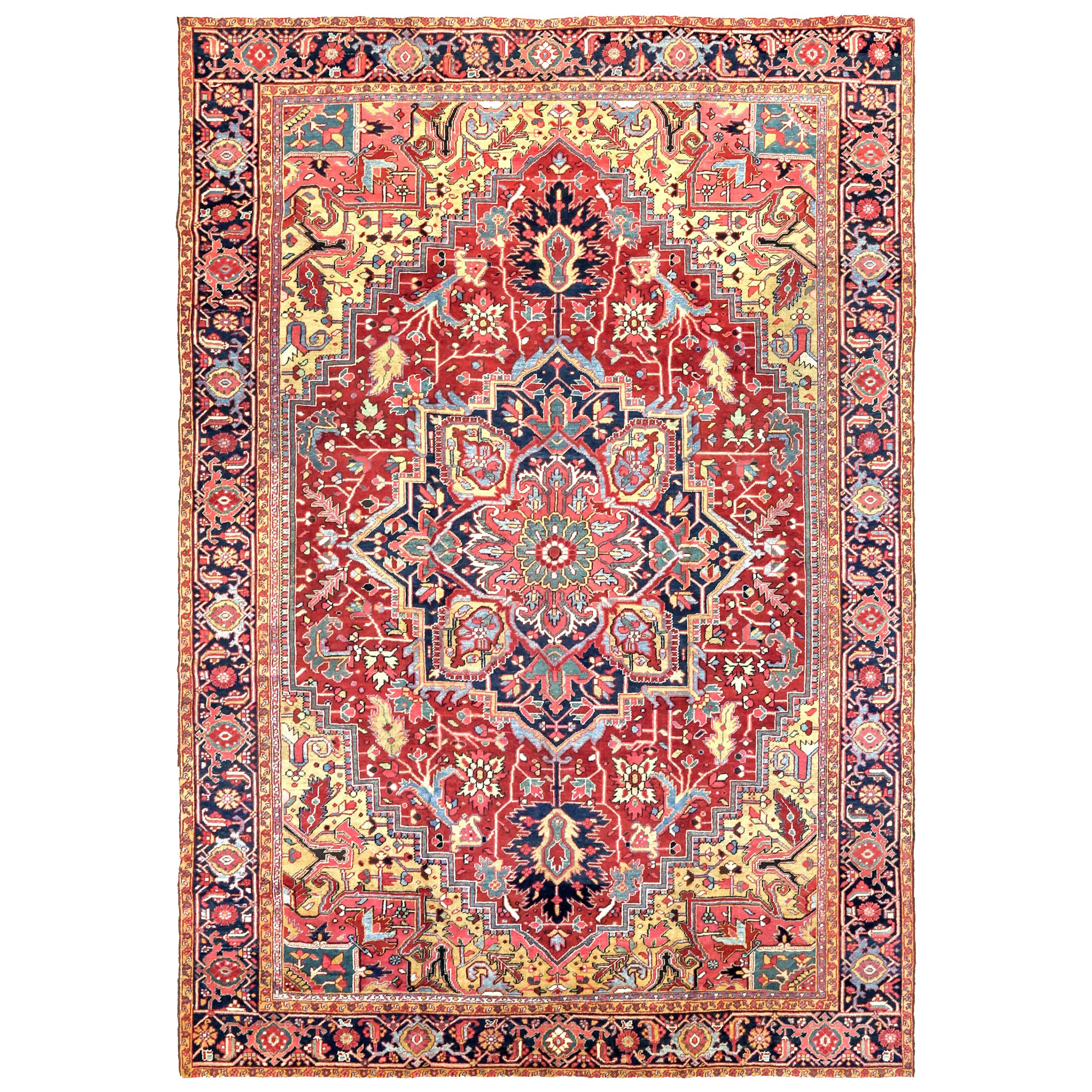 9'5" x 13'7" Antique Persian Heriz carpet with a navy blue and coral medallion on a brick red field. Uncommon yellow corner spandrels and a navy blue border frame the field, northwest Persia, circa 1920. Douglas Stock Gallery antique Heriz carpets Boston,MA area New England, antique Hereiz carpets NYC by appointment, antique Heriz carpets Washington,DC area by appointment
