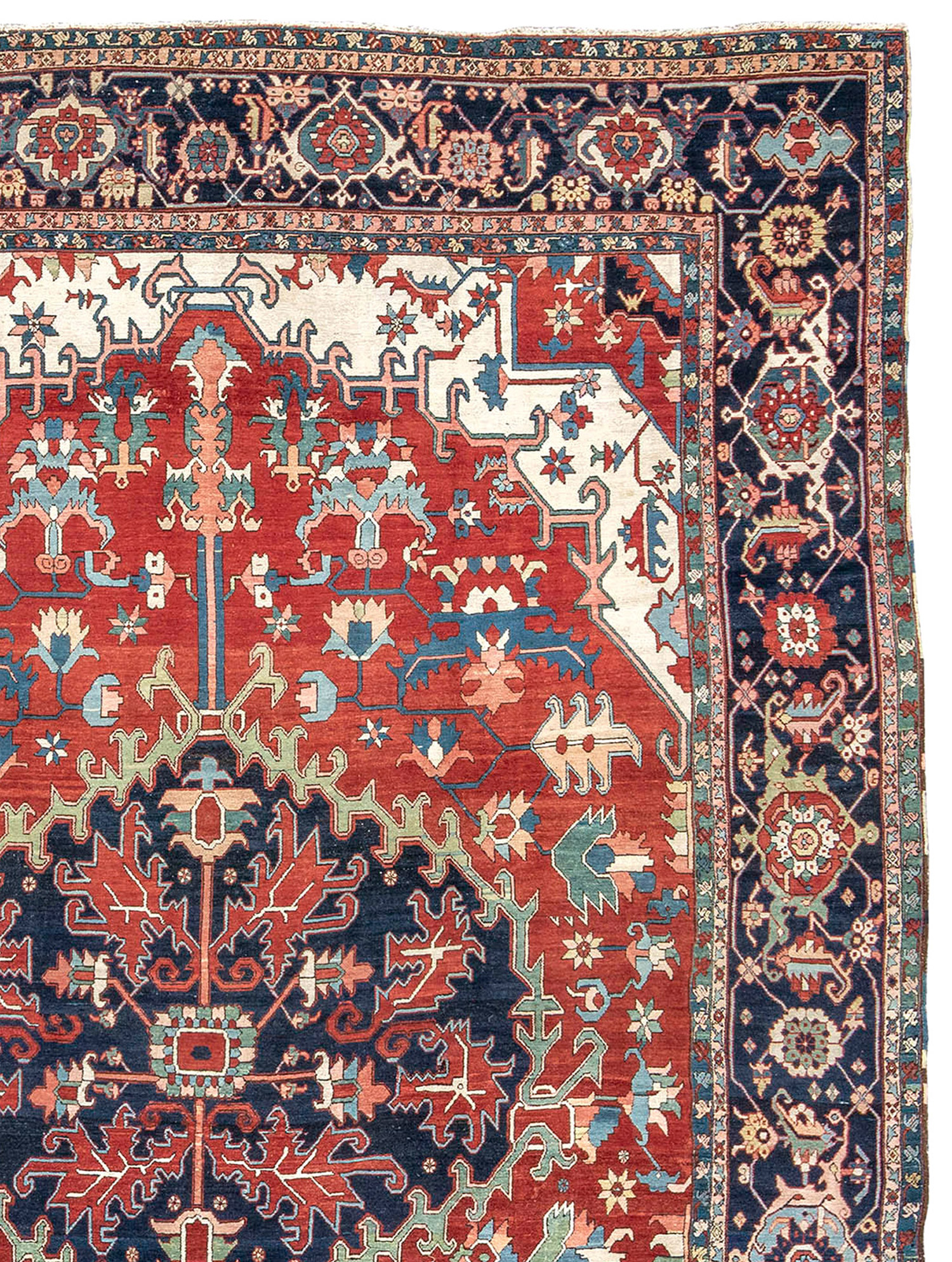 Detail of an antique northwest Persian Karaja Serapi carpet with a navy medallion on a paprika color field that is framed by ivory corner spandrels and a navy blue Turtle design border, Douglas Stock Gallery Antique Oriental Rug Research Archives, Boston,MA area, New England