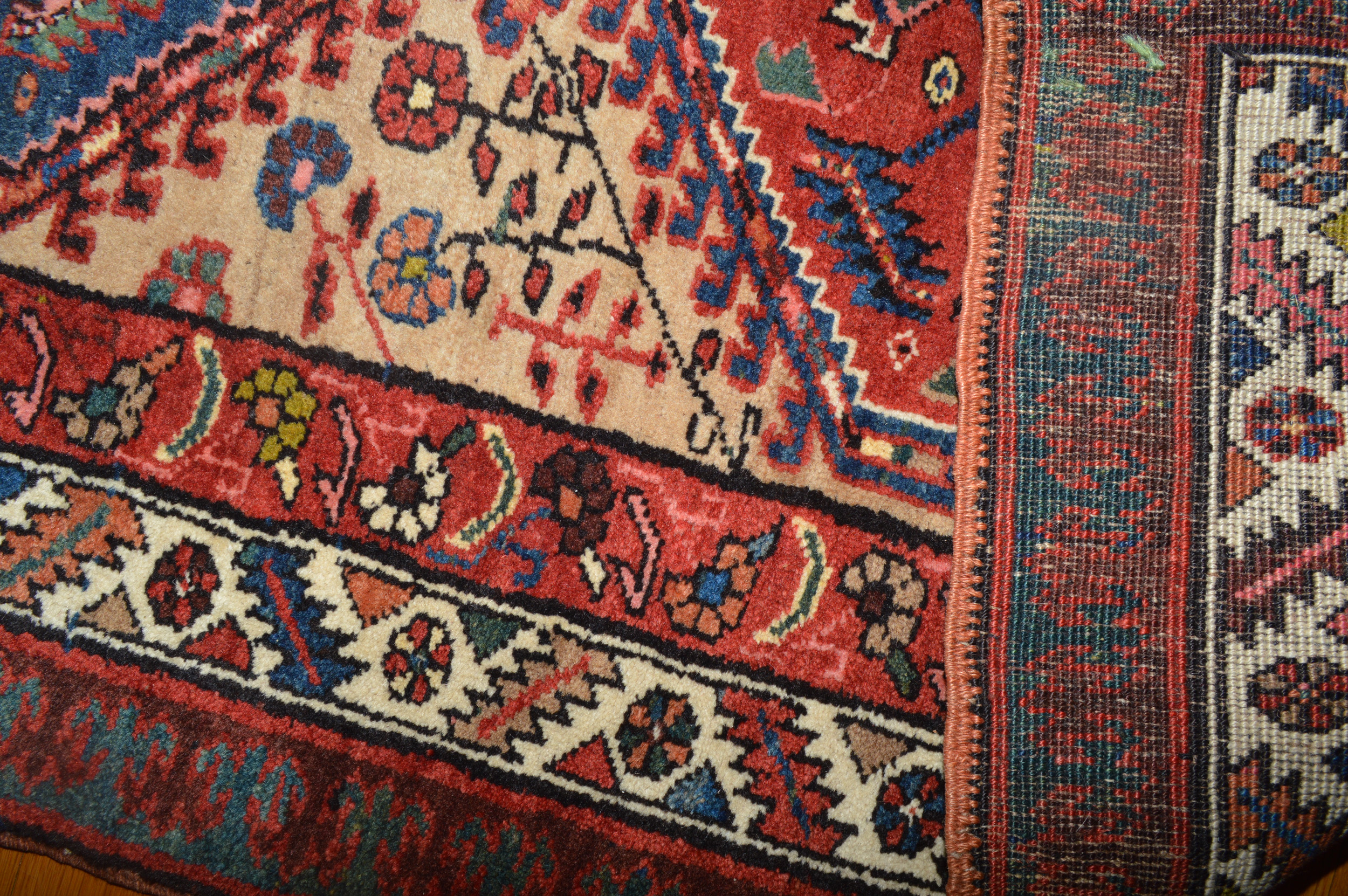 Detail of a charming antique Persian Serab rug with stylized flowers and three medallions on a light camel color field, Douglas Stock Gallery, antique Oriental rugs, antique runner rugs Boston,MA area