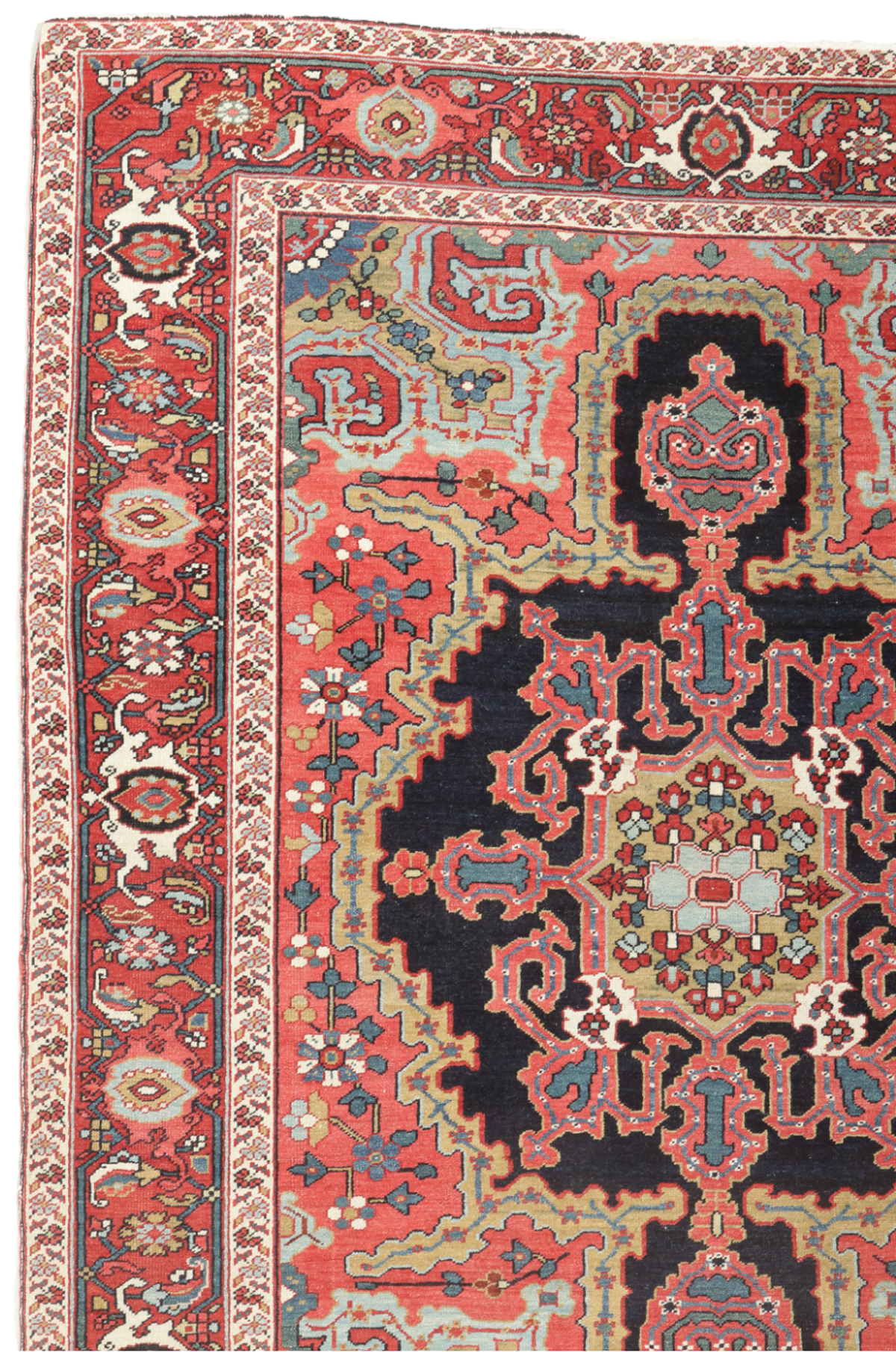 Detail of an antique northwest Persian Heriz "Serapi" rug with a navy medallion with camel and coral trim on a coral color field that is framed by light blue and camel corner spandrels and a brick red Turtle border - Douglas Stock Gallery, antique Oriental rugs Boston, Brookline, Cambridge, Newton, Weston, Wellesley, Natick,MA area Oriental rugs