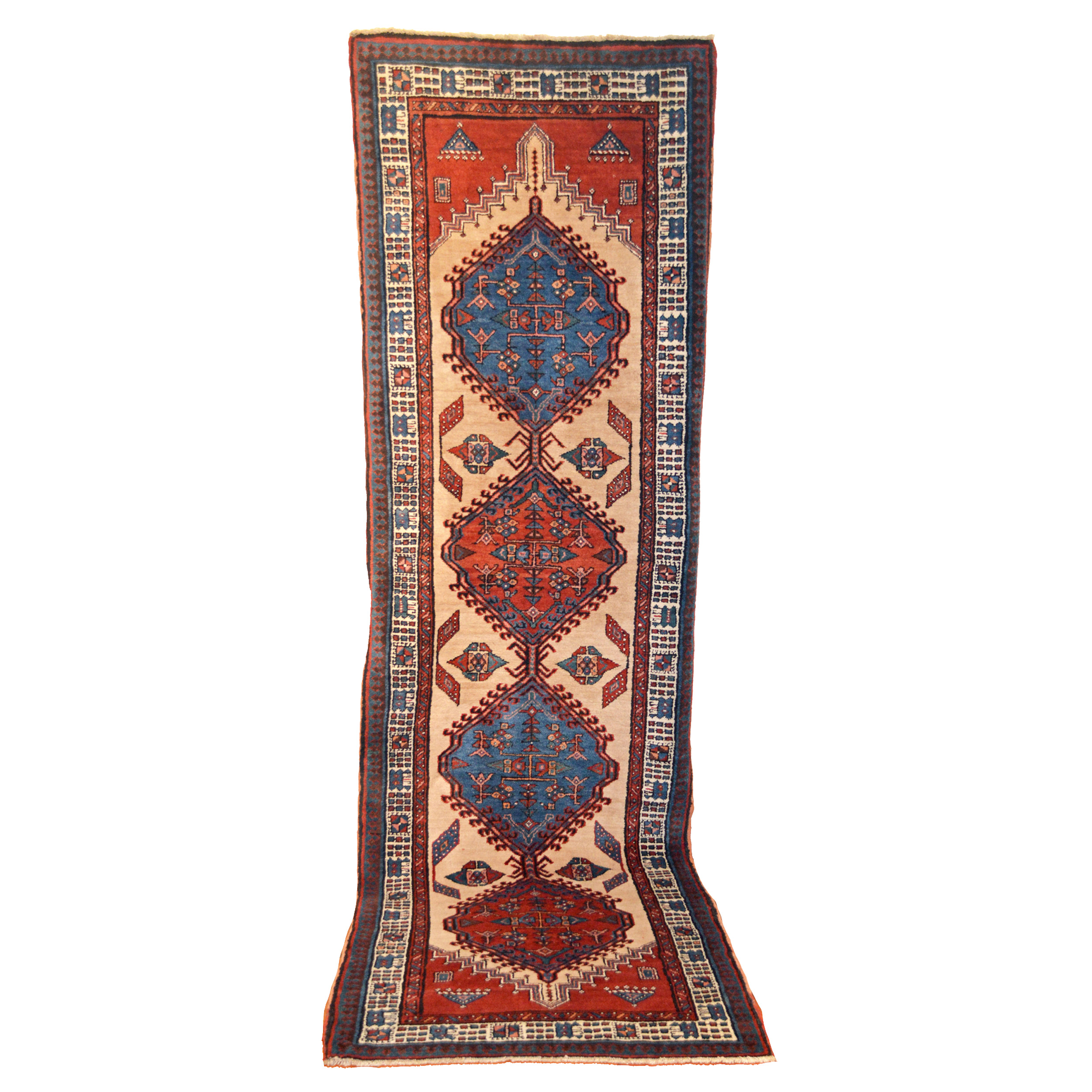A vintage Persian Serab runner, circa 1930, with two mid blue and two soft red medallions on a light camel color field. Douglas Stock Gallery, antique Persian runner rugs, antique Oriental rugs Boston,MA area