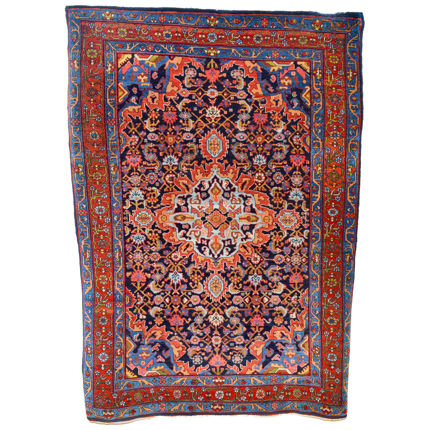 An antiquePersian Bidjar rug, with a sky blue and red medallion on a navy blue field that is decorated with the classical "Herati" design, northwest Persia, Kurdistan province, circa 1910 - Douglas Stock Gallery, antique Oriental rugs Boston,MA area, antique rugs New England, antique rugs New York