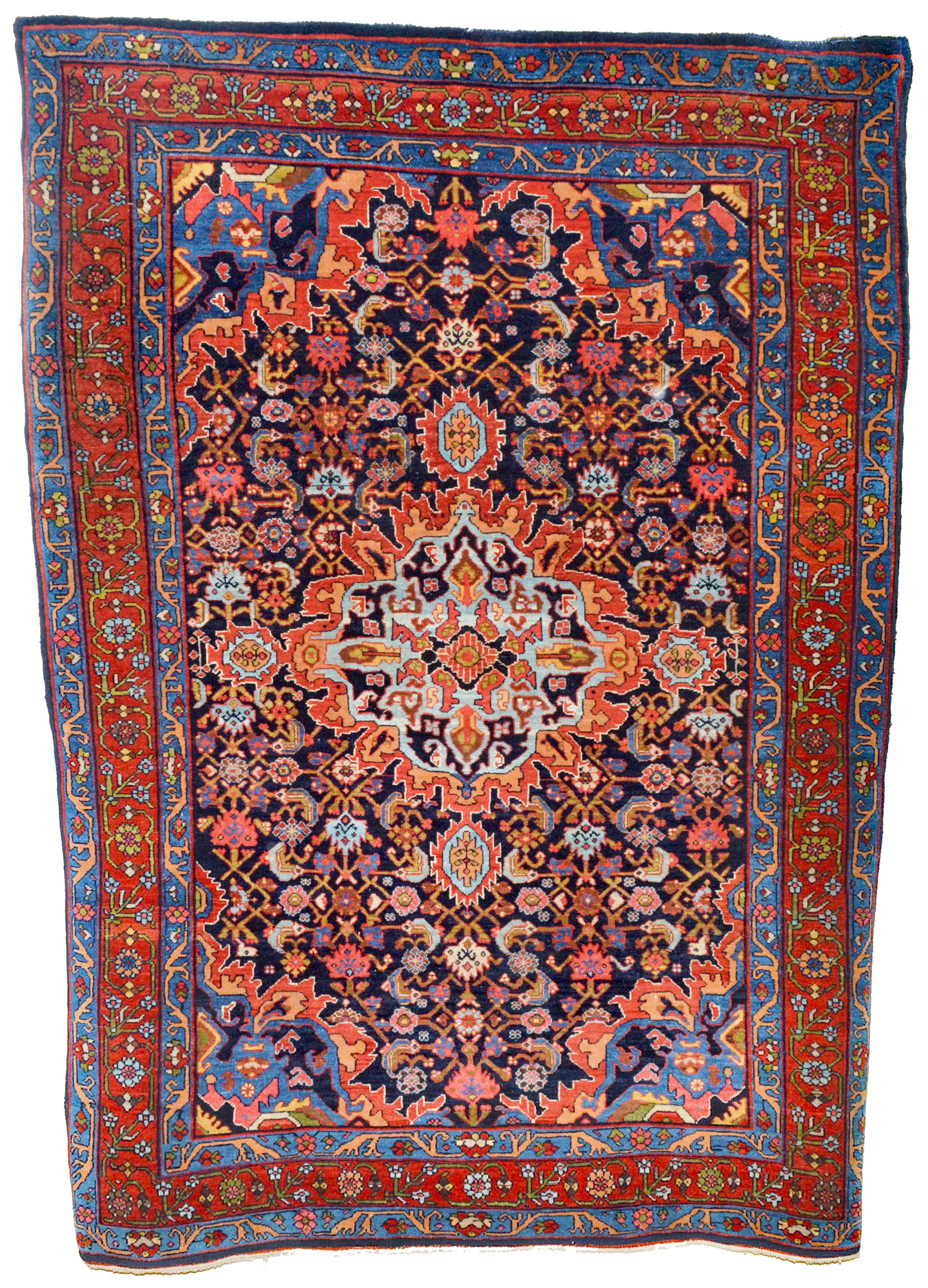 A distinctive antique Persian Bidjar rug with a dramatic sky blue and red medallion on a navy blue field that is decorated with the classical "Herati" design. A red border with scrolling vines and flowers and mid blue guard borders frame the field, circa 1910. Douglas Stock Gallery is the Boston areas most selective dealer in antique Oriental rugs. Shop in South Natick, MA, near Wellesley, Weston, Newton and Brookline, is open by appointment Monday to Saturday.