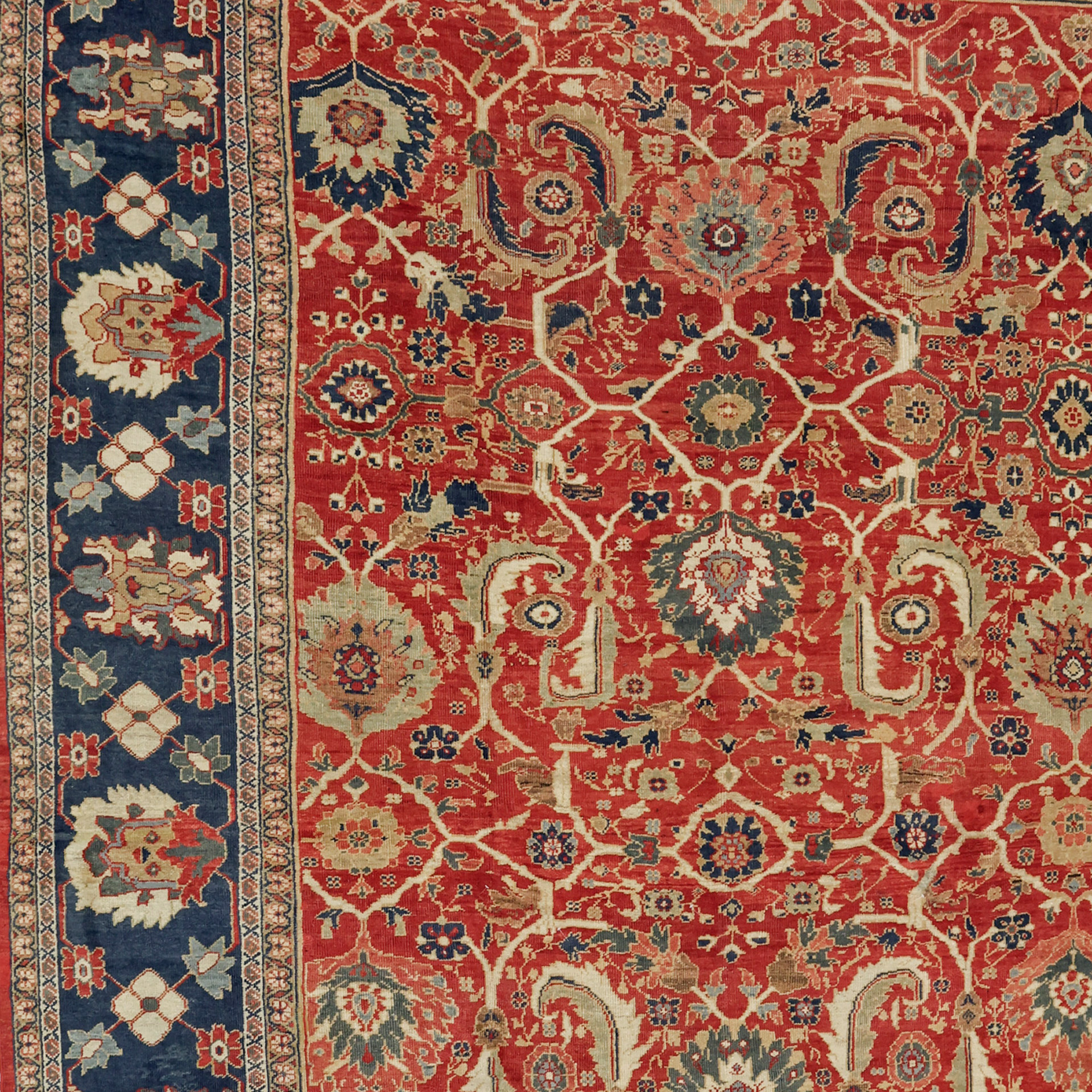 Detail photo of an antique Persian Ziegler Mahal carpet with palmettes and leaves on a brick color field that is framed by a navy border, circa 1900 - Douglas Stock Gallery, antique Oriental rugs Boston,MA area.