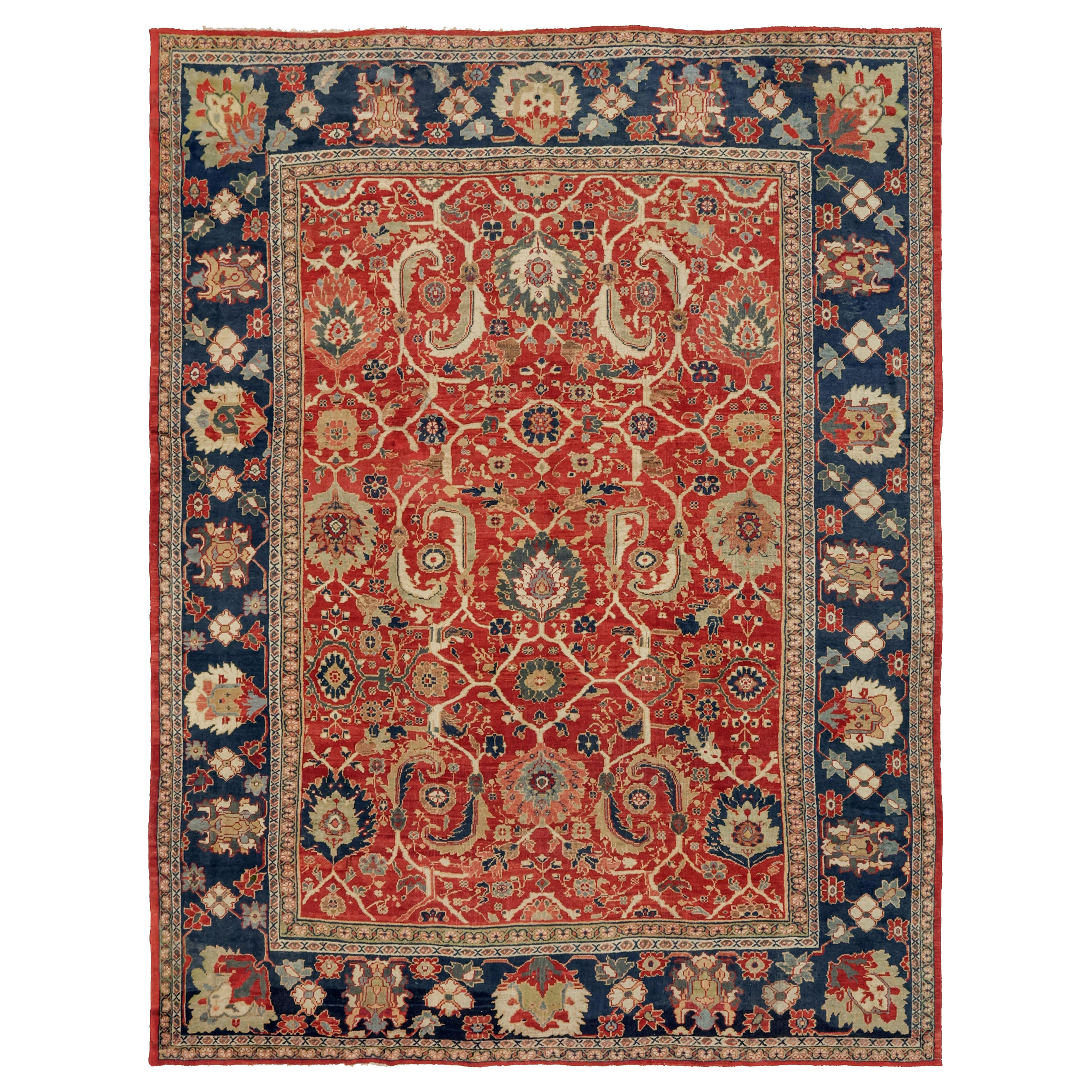 An over size antique Persian Mahal carpet probably commissioned by the Anglo-Swiss firm Ziegler & Co., circa 1900. The red field is decorated with leaves and palettes and framed by a navy blue border. Douglas Stock Gallery is one of America's most selective dealers in antique Persian carpets, antique rugs Boston. antique rugs Brookline, antique rugs Newton, antique rugs Weston, antique rugs Wellesley, antique rugs Natick,MA area