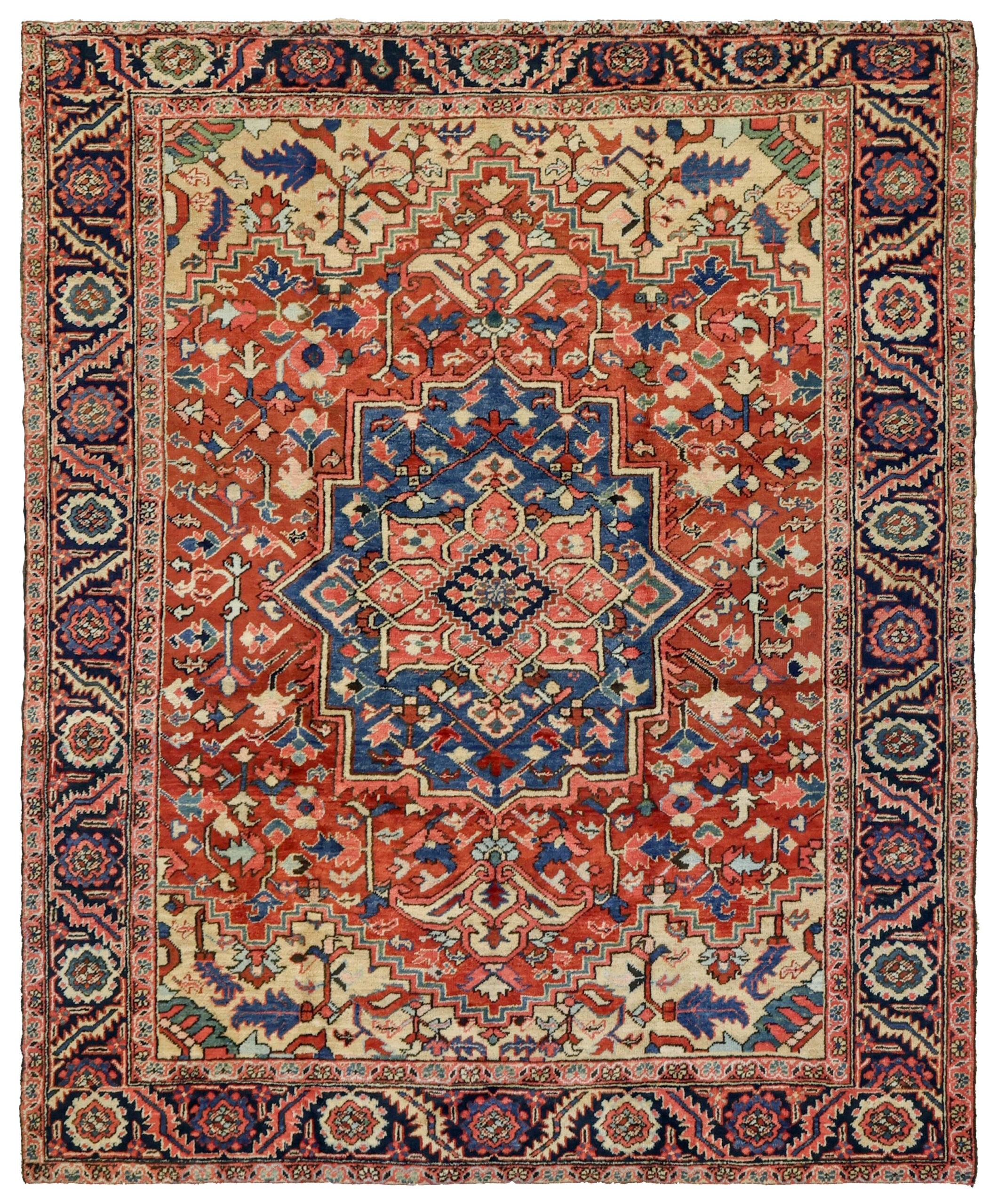 An antique Heriz carpet with a denim blue and coral medallion on a terra cotta color field that is framed by light camel color spandrels and a navy blue border, northwest Persia, circa 1920. Douglas Stock Gallery offers exceptional quality antique carpets from the Heriz district in northwest Persia, including Heriz carpets, Serapi carpets, Karaja carpets Goravan carpets and Bakshaish carpets. Antique rugs Boston,MA area