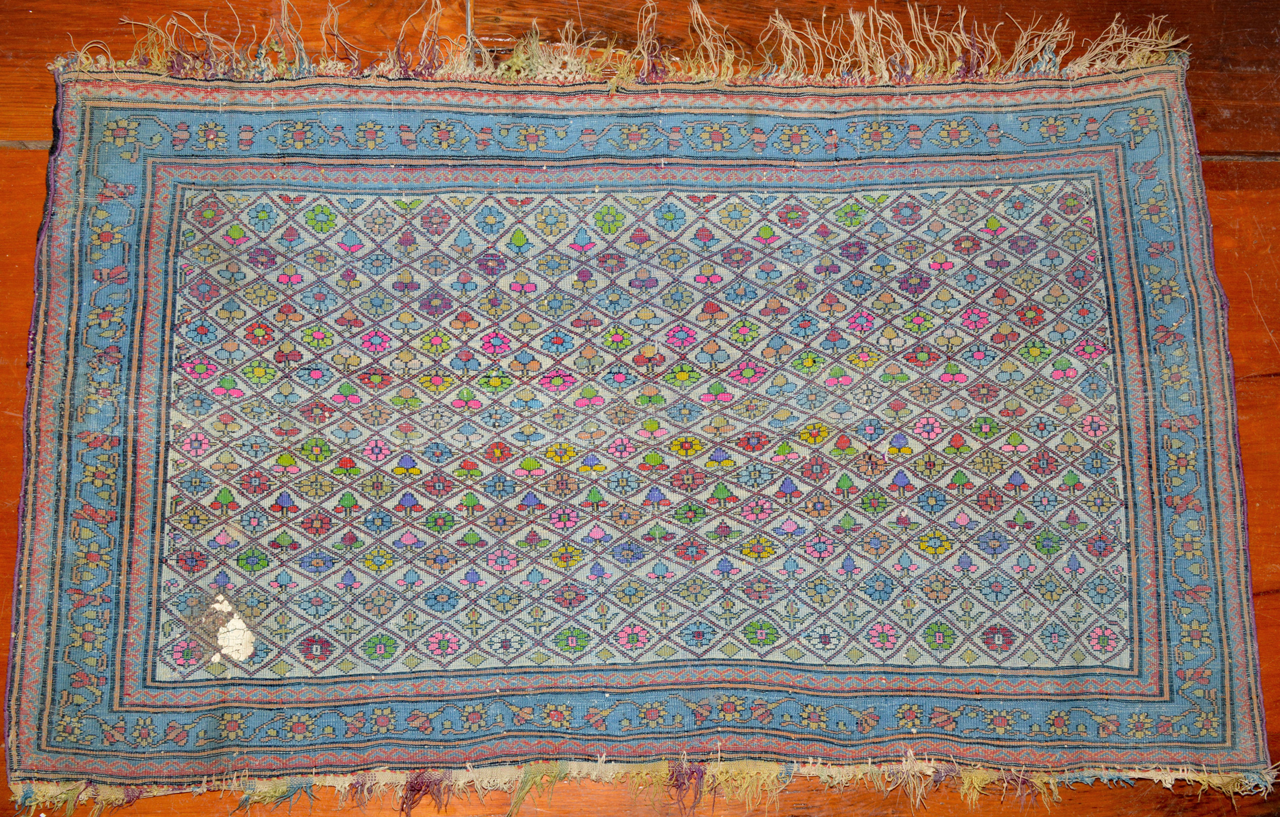 A view of the back of a small antique Mohtasham Kashan rug showing the weave and the wide use of synthetic dyes. Based on other factors, such as the design and pliable handle and light weight, this seems to be from the earlier period of Mohtasham Kashan production, circa 1880 to 1890. The wide use of synthetic dyes in the lattice and flower design field is an interesting aspect from an art history perspective. Douglas Stock Gallery is a nationally regarded dealer in antique Persian rugs and other types of antique Oriental rugs. Based in the Boston,MA area in historic South Natick,MA, 5 minutes from Wellesley center, our shop is open Monday to Saturday by appointment or chance. Helen and Douglas Stock of Douglas Stock Gallery work with individual clients, architects and interior designers across the United States who are interested in top quality 19th century Oriental rugs and room size antique carpets.
