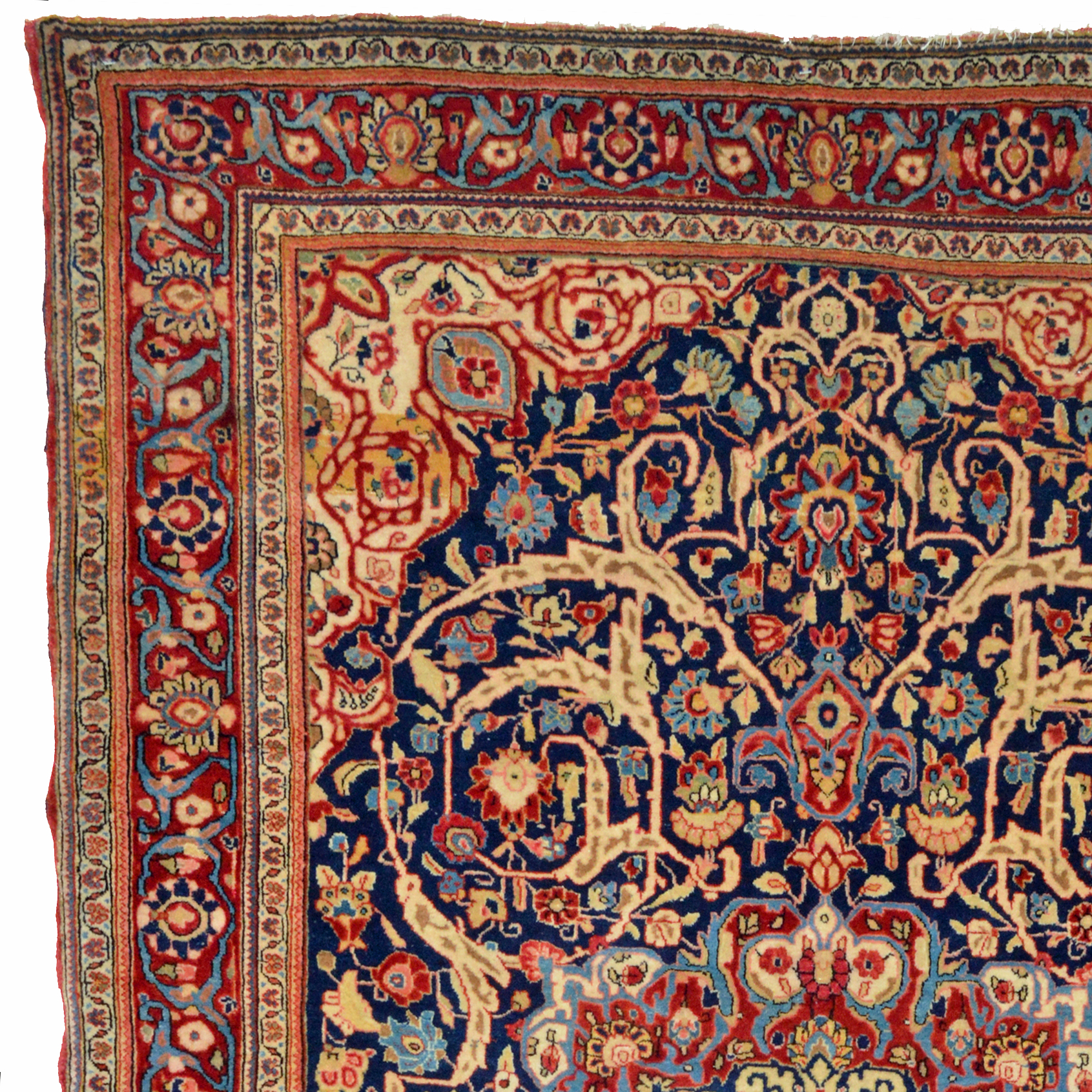 Detail of an antique Persian Fereghan Sarouk rug. The navy blue field is decorated with a claret color medallion and sweeping vines and leaves with flowers. Ivory corner spandrels and a claret color border with ivory guard borders frame the field, central Persia, circa 1915. Douglas Stock Gallery specializes in antique Sarouk rugs, Fereghan Sarouk rugs, Jozan Sarouk rugs and Mahajaran Sarouk rugs.